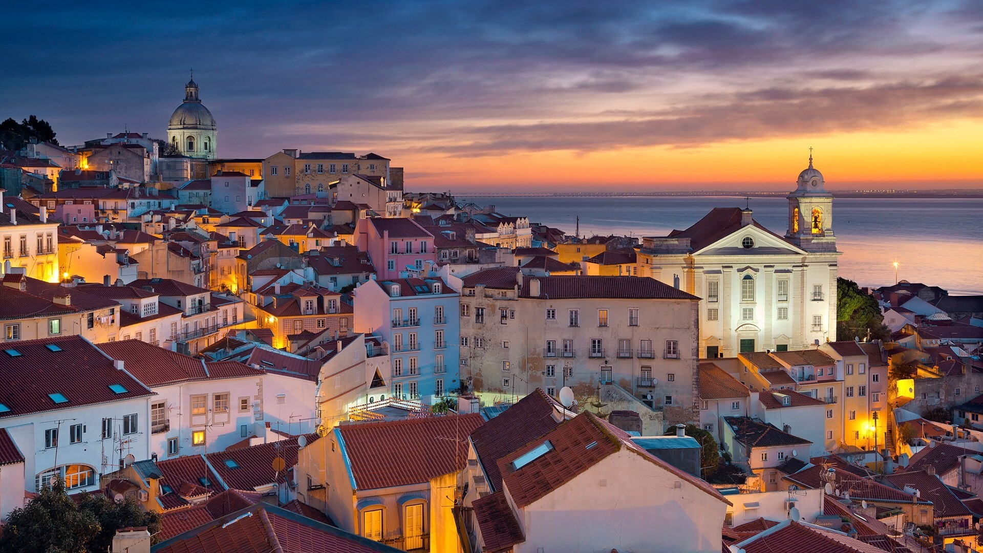 Lisbon Alfama district at sunset with river HD Wallpaper