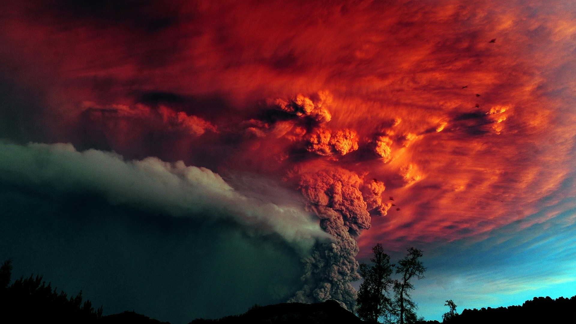Volcanic eruption with red clouds HD Wallpaper