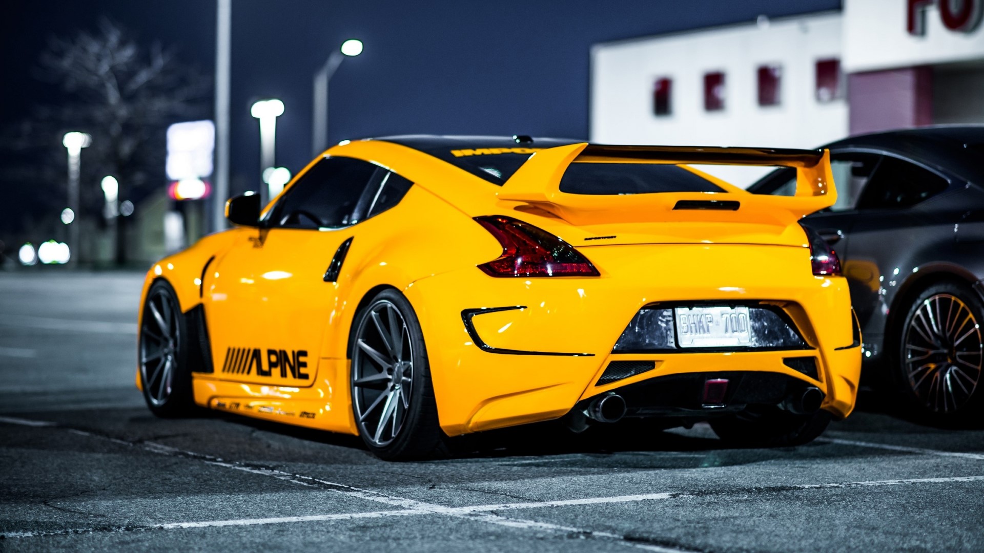 Yellow Nissan 370Z with a spoiler HD Wallpaper