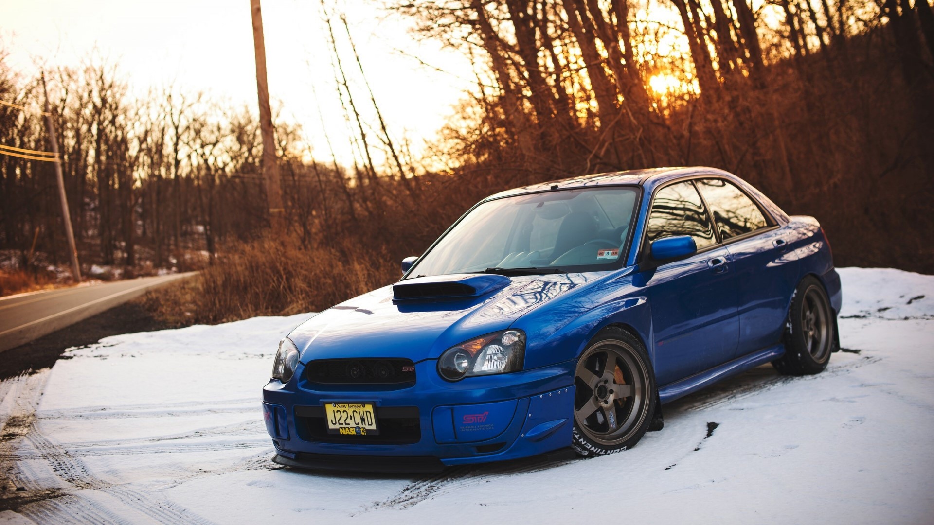 Blue Subaru Impreza STI in Snow HD Wallpaper