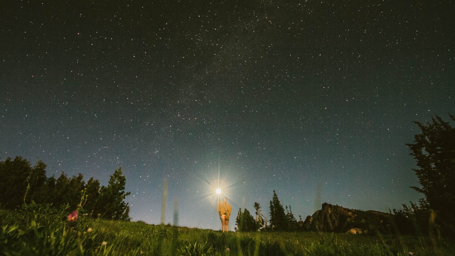 Girl with flashlight under starry sky HD Wallpaper