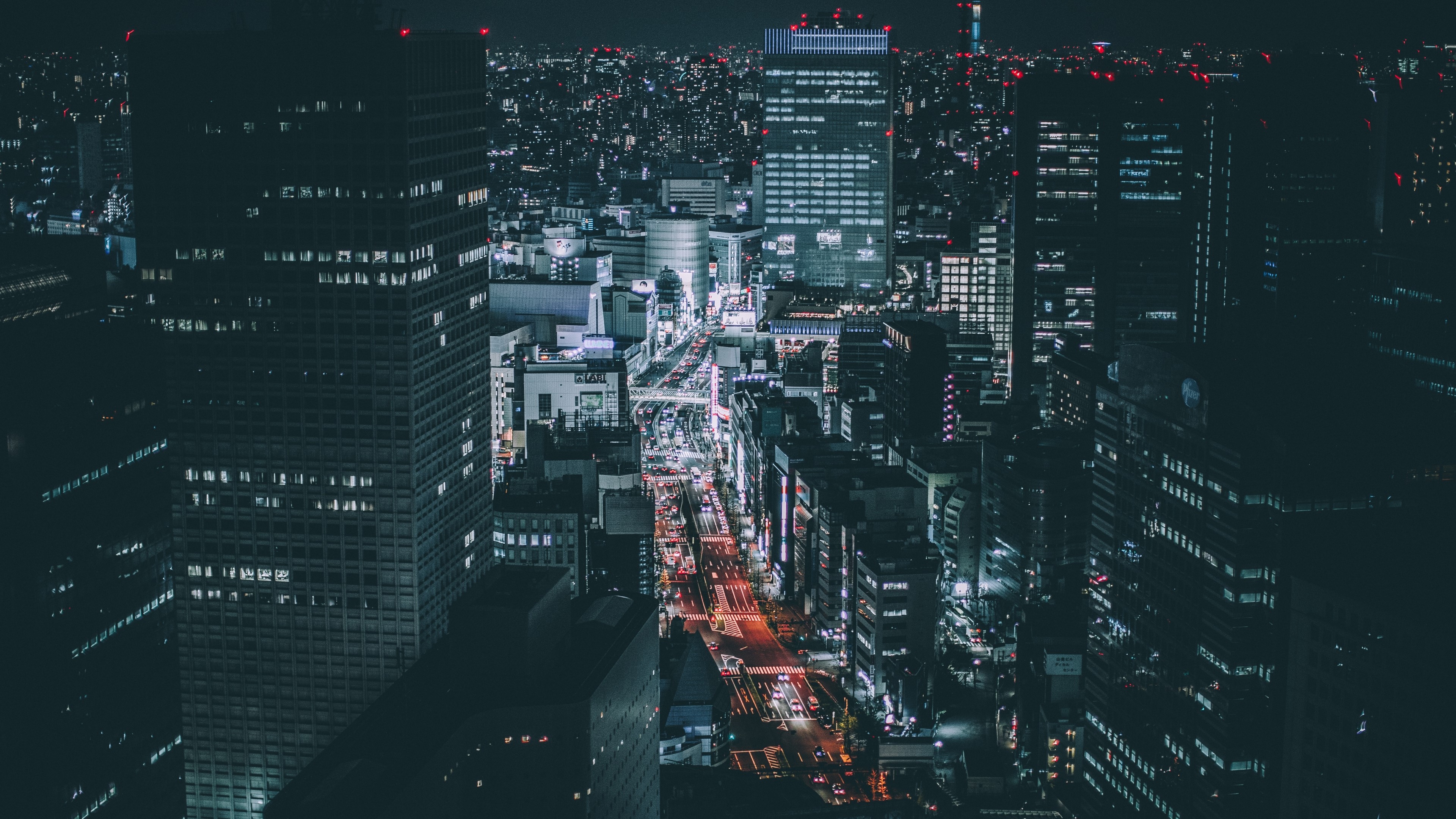 4K Night Cityscape with Skyscrapers and Traffic HD Wallpaper
