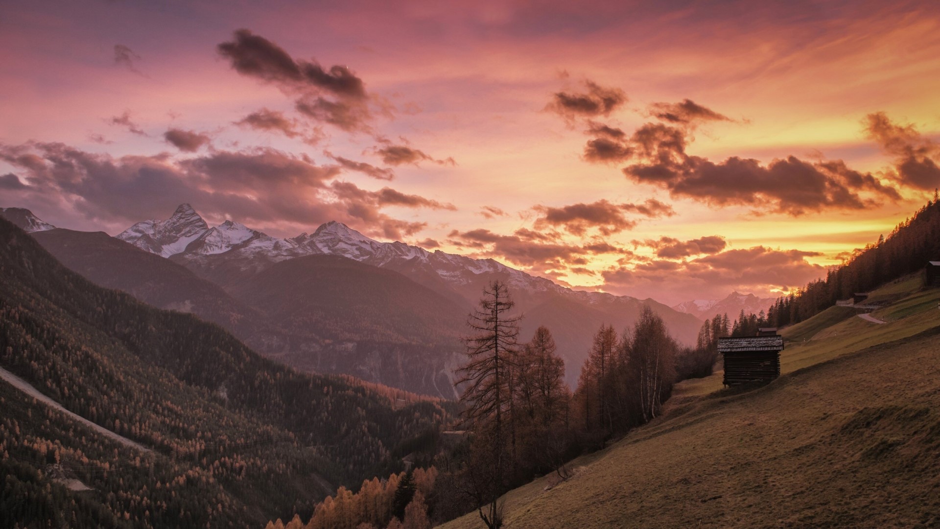 Sunset over snow-capped mountains in Switzerland HD Wallpaper
