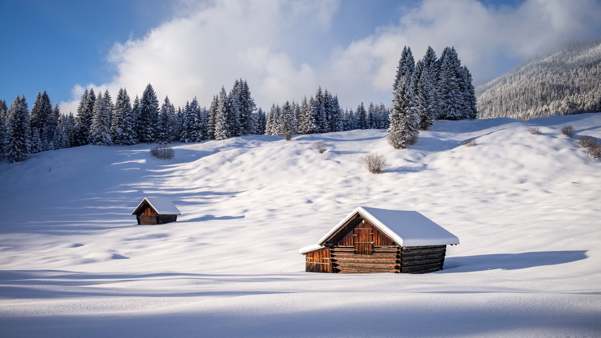 Snowy landscape with wooden cabins in Bavaria, Germany HD Wallpaper