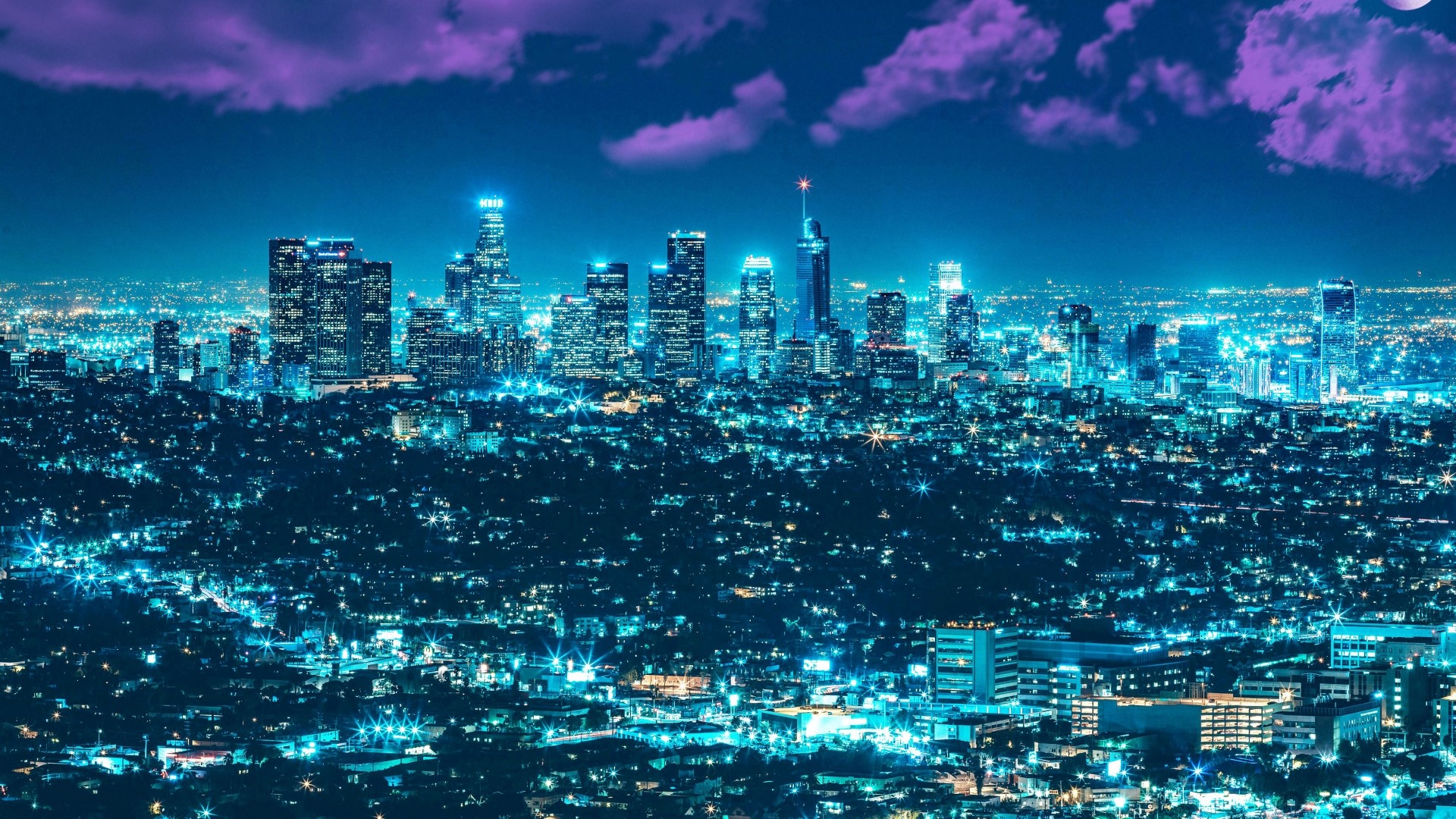 Los Angeles skyline at night with purple clouds HD Wallpaper
