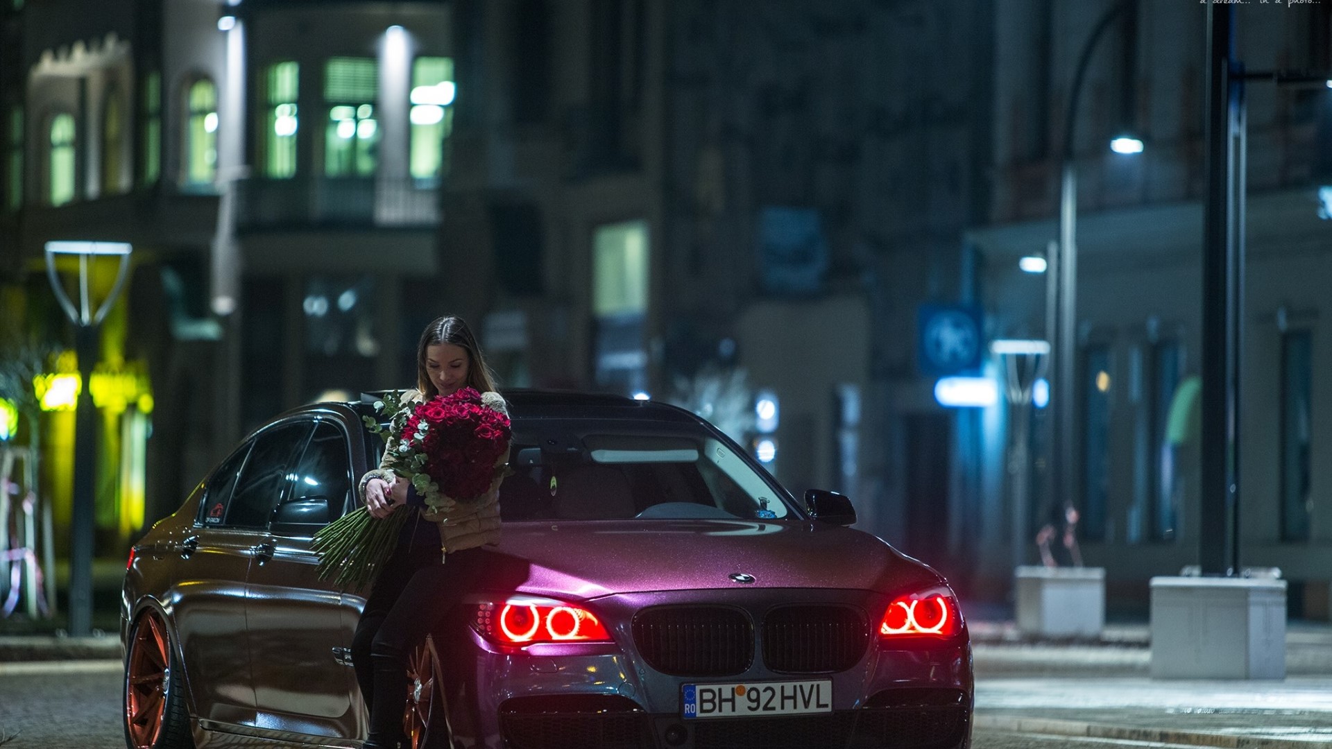 Woman with roses and BMW 7 Series at night HD Wallpaper