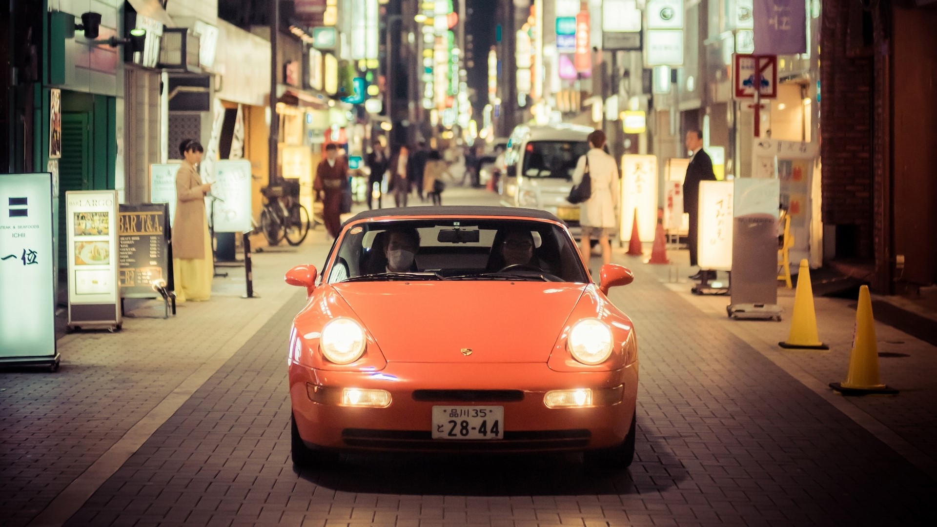 Orange Porsche driving in Tokyo at night HD Wallpaper