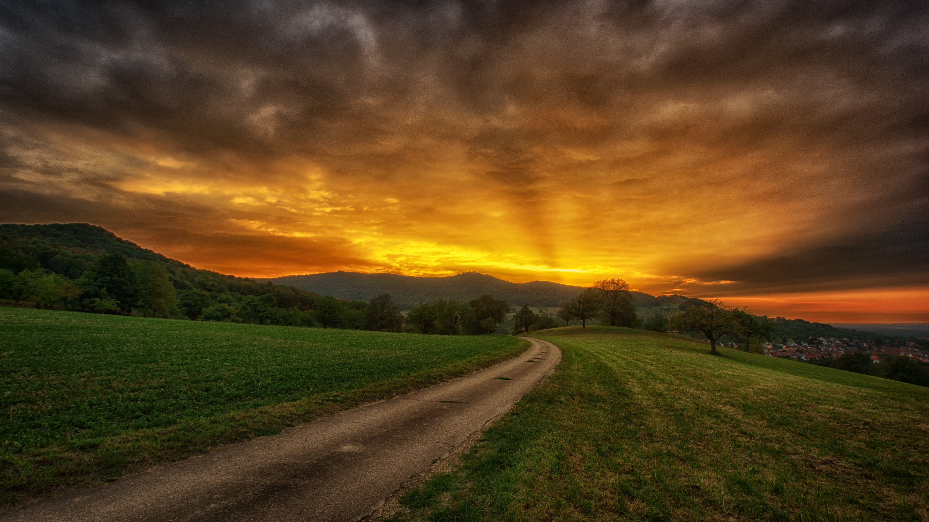 4K Sunset Over Rolling Hills HD Wallpaper