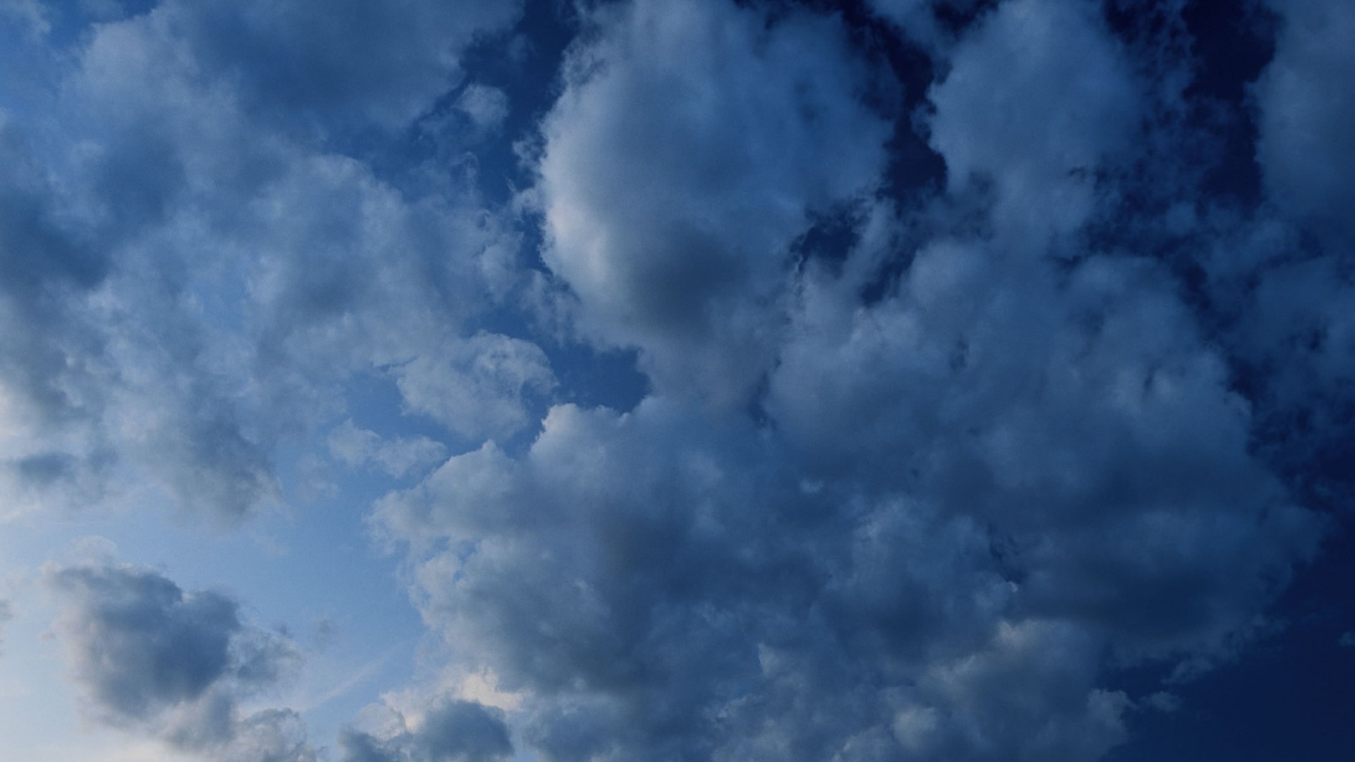 Dark clouds in a blue sky after rain HD Wallpaper