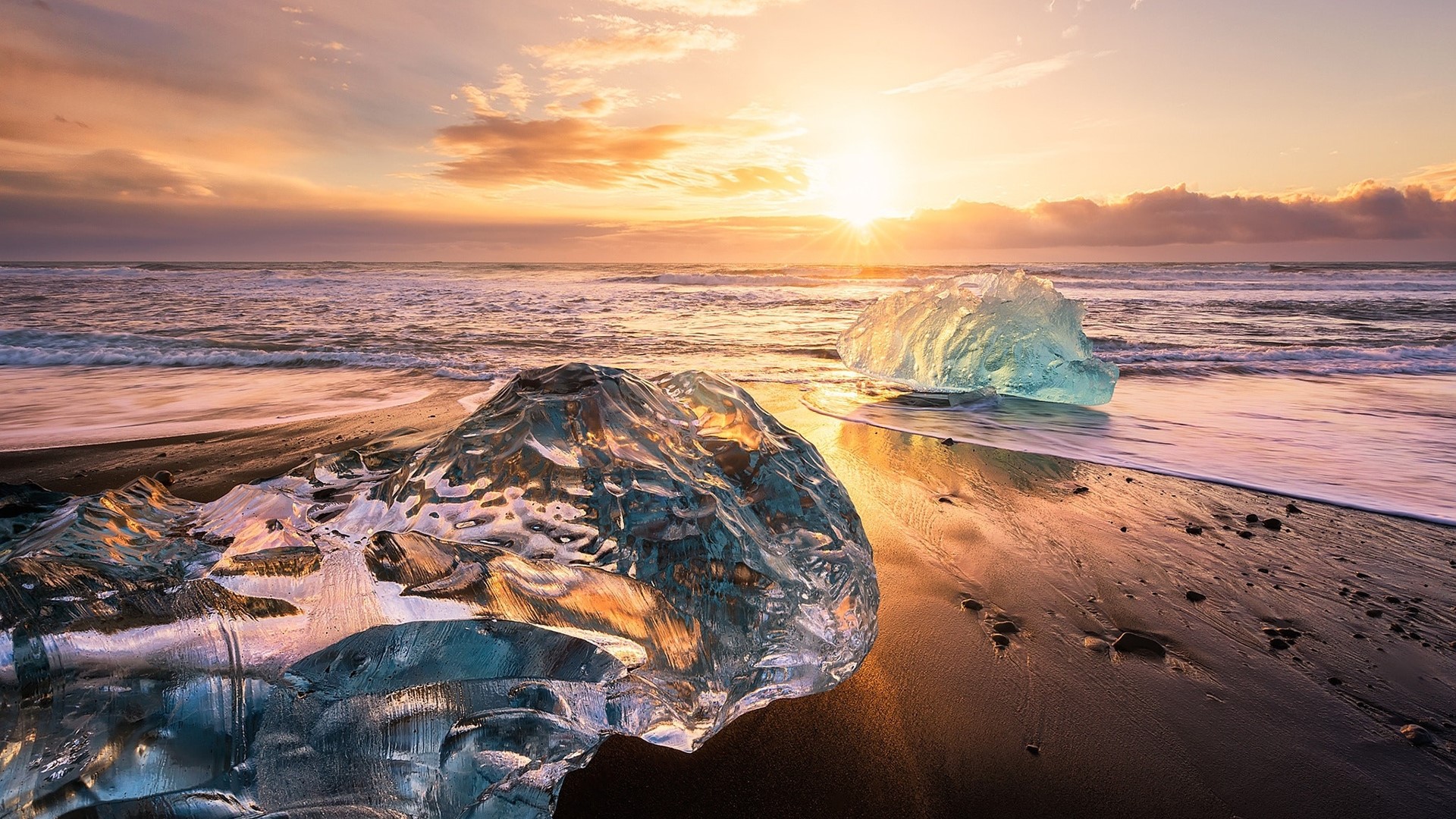 Icebergs on a beach at sunset in Iceland HD Wallpaper