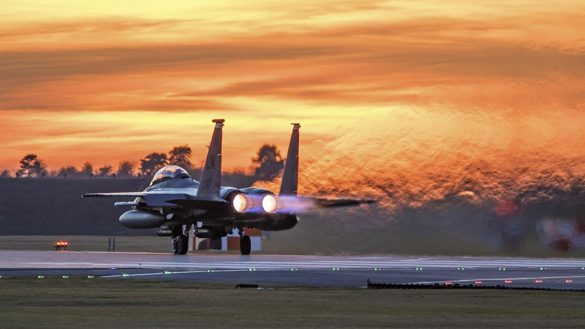 McDonnell Douglas F-15E Strike Eagle taking off at sunset HD Wallpaper