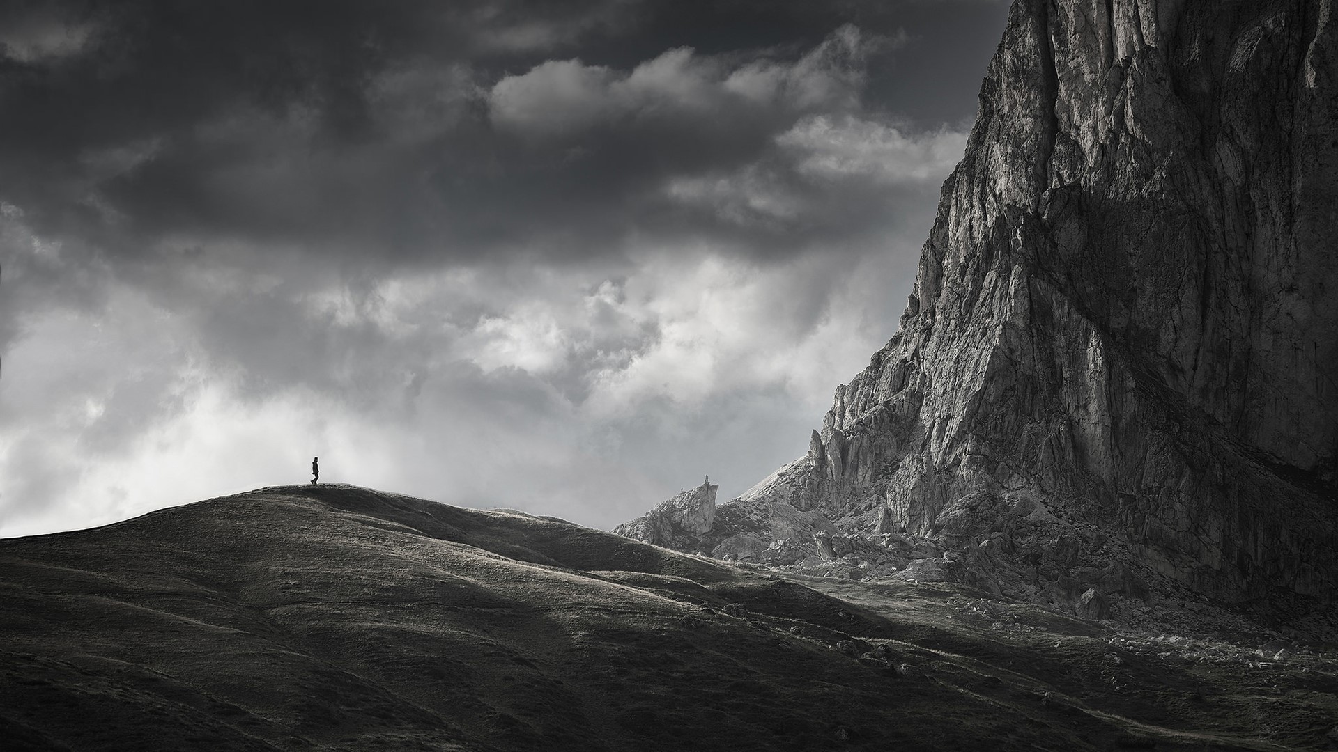 Person on a mountain ridge in the Dolomites, Italy HD Wallpaper