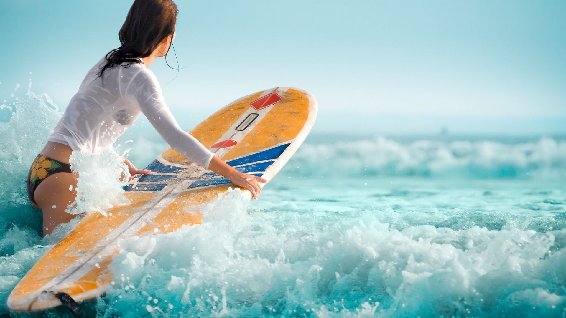 Woman with surfboard in the ocean HD Wallpaper