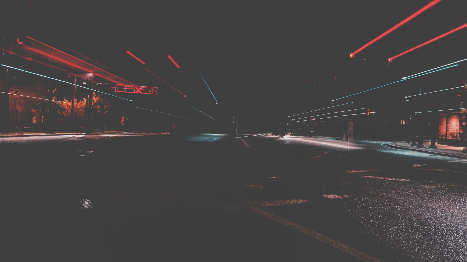 Light trails on a dark road at night HD Wallpaper