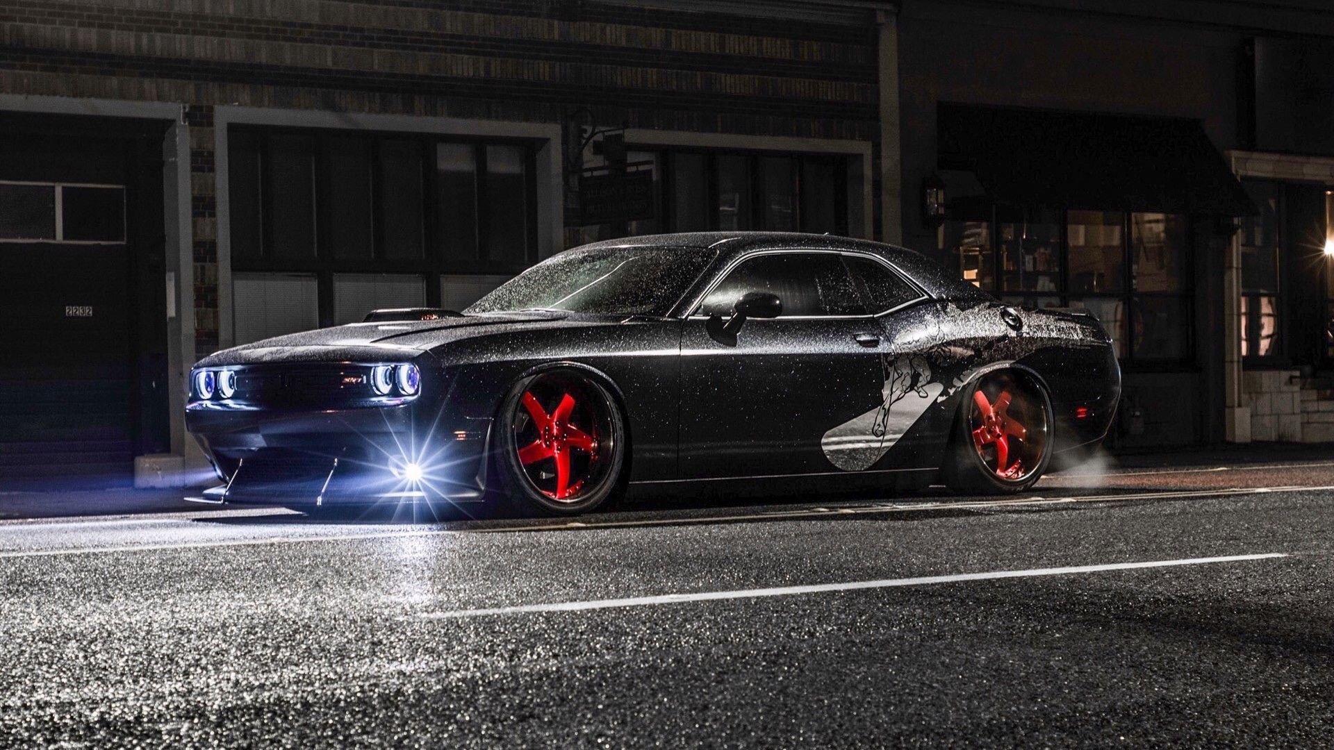 Black Dodge Challenger SRT8 with red rims on wet street HD Wallpaper
