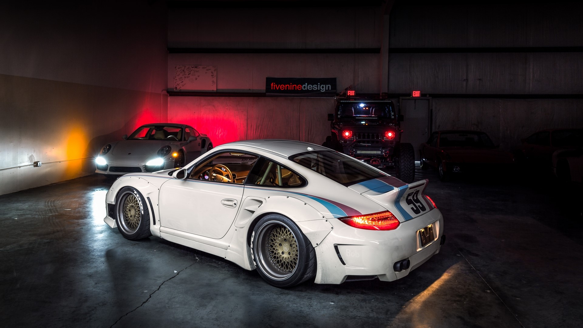 White Porsche 911 with racing stripes and a black Jeep HD Wallpaper