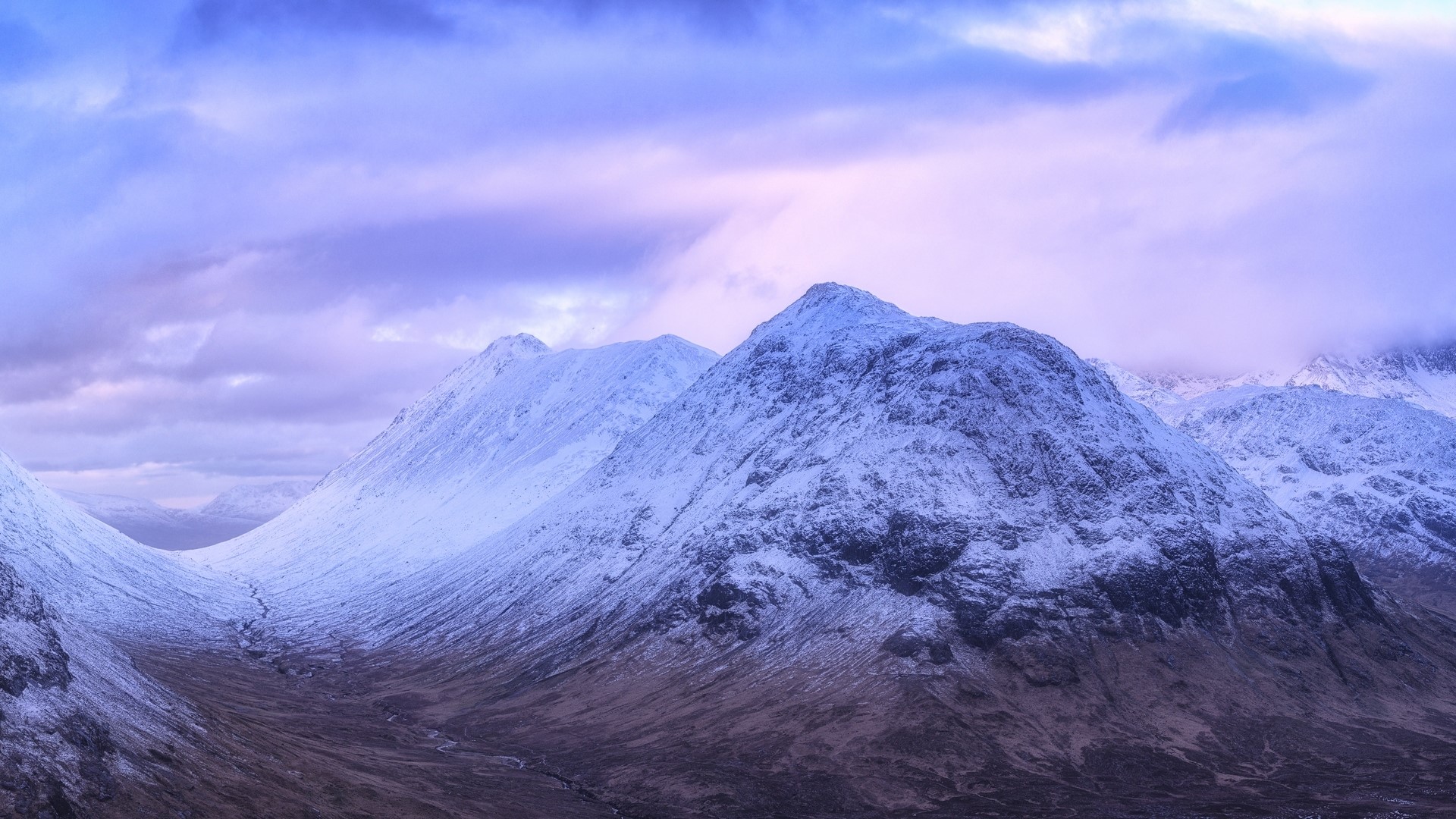 Snow-covered mountains under a purple sky HD Wallpaper