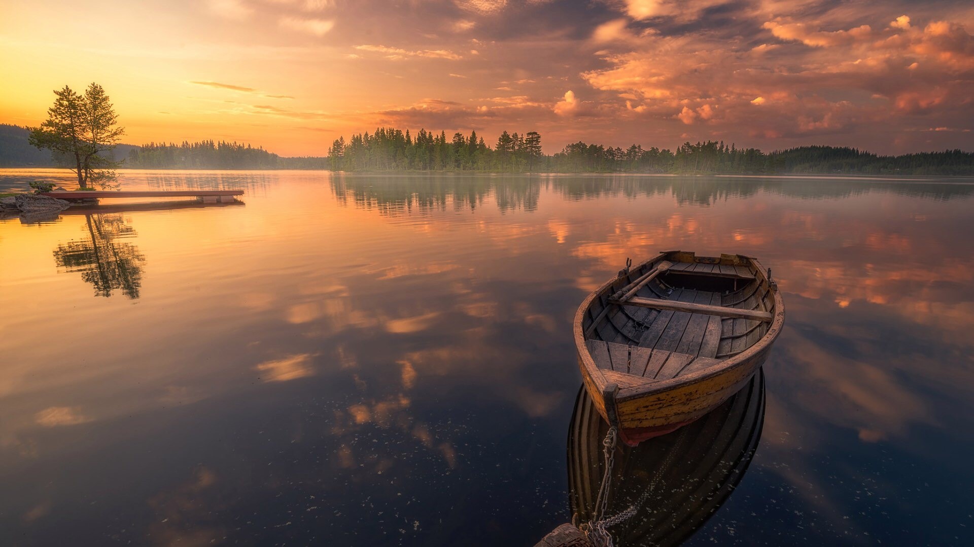 Boat on a lake at sunset HD Wallpaper