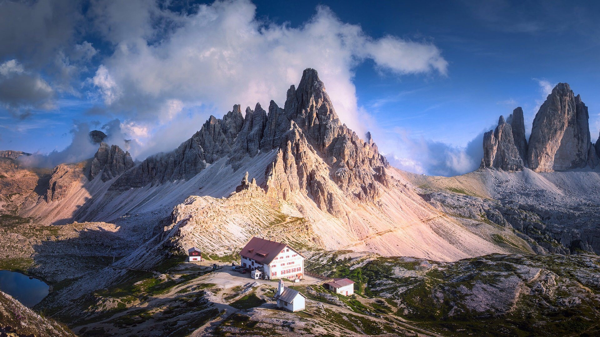 Dolomites in Italy with mountain huts HD Wallpaper