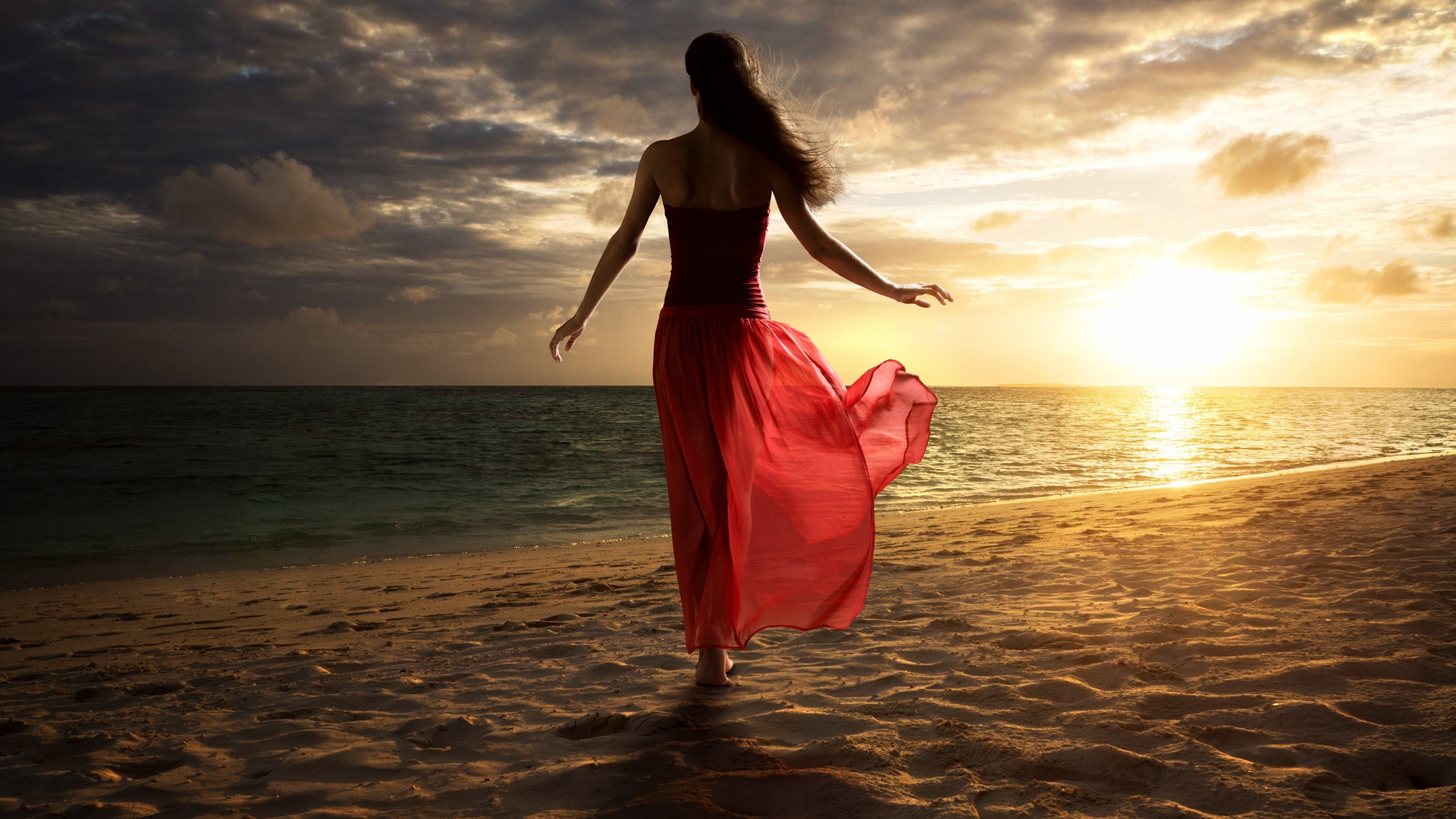 Girl in red dress on beach at sunset HD Wallpaper