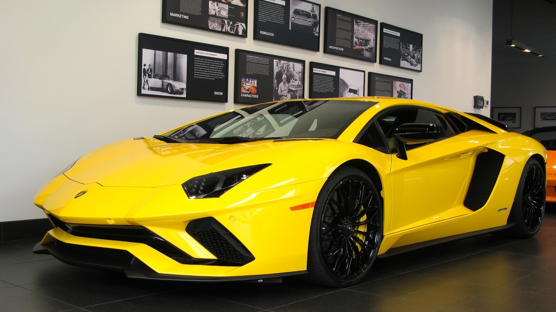 Yellow Lamborghini Aventador in showroom HD Wallpaper