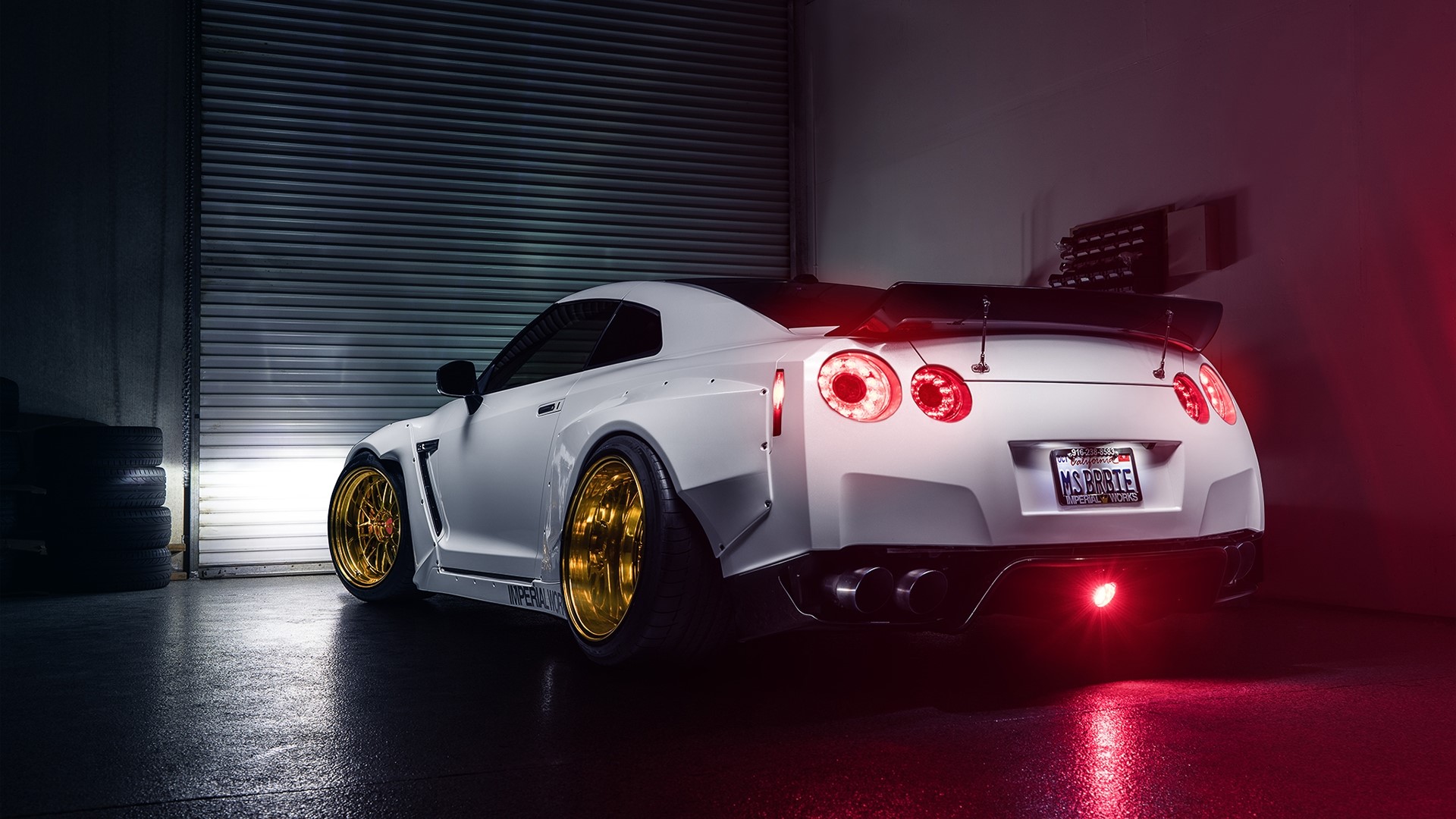 White Nissan GT-R with gold rims in garage HD Wallpaper
