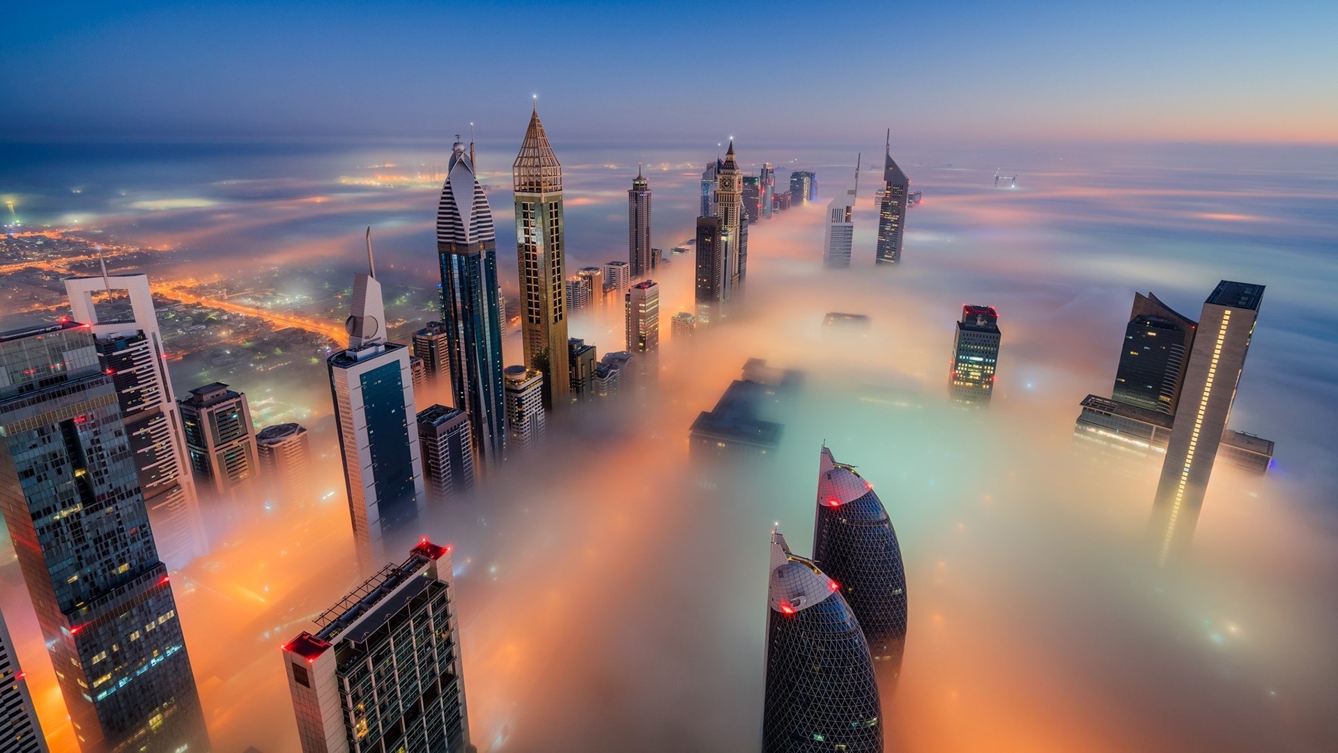 Dubai skyscrapers shrouded in fog at dawn HD Wallpaper
