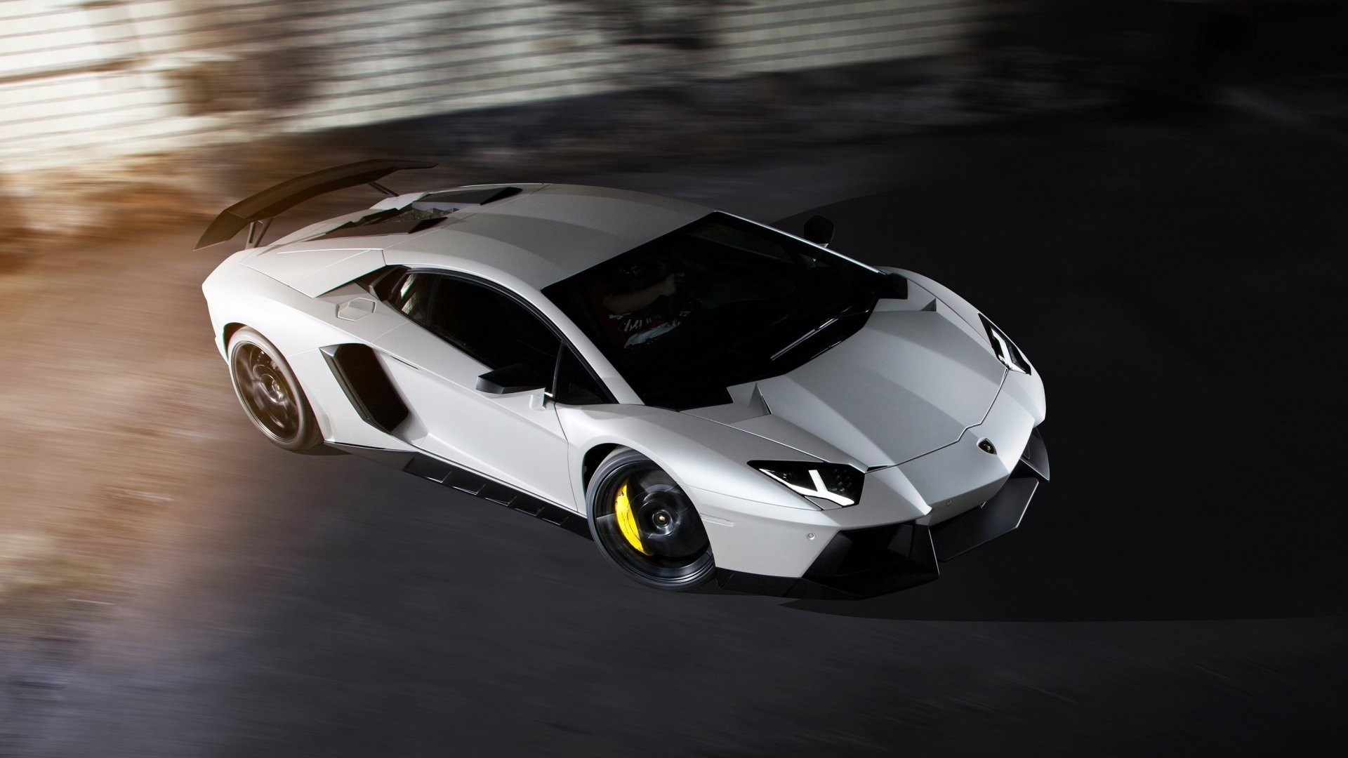 White Lamborghini Aventador driving fast HD Wallpaper
