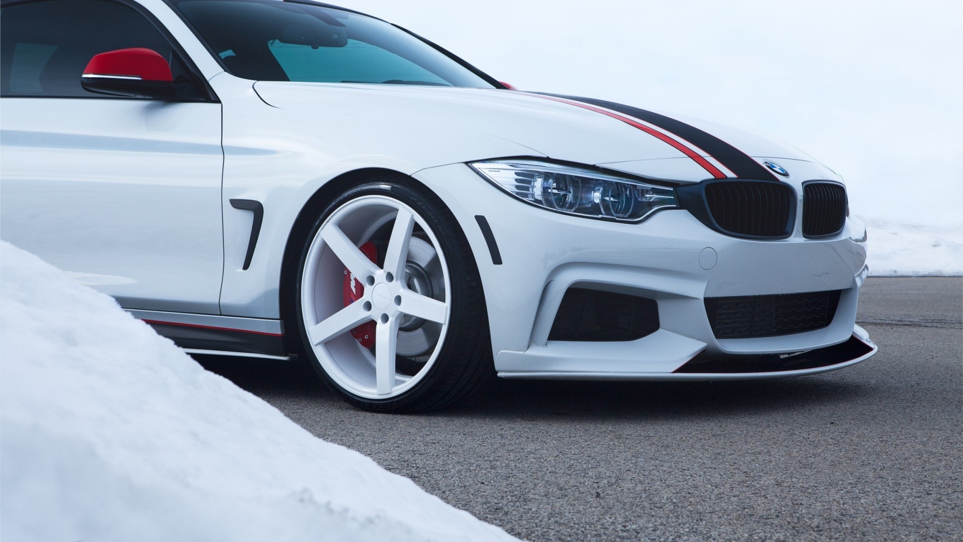 White BMW M4 Coupe with racing stripes HD Wallpaper
