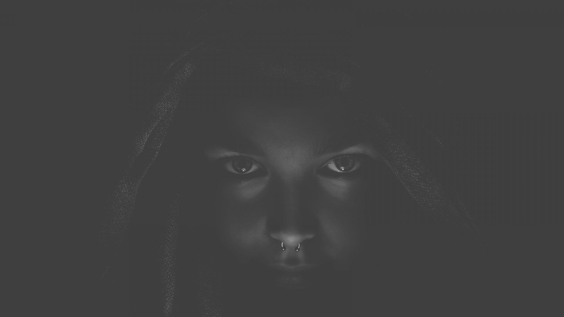 Person with nose ring wearing a hood HD Wallpaper