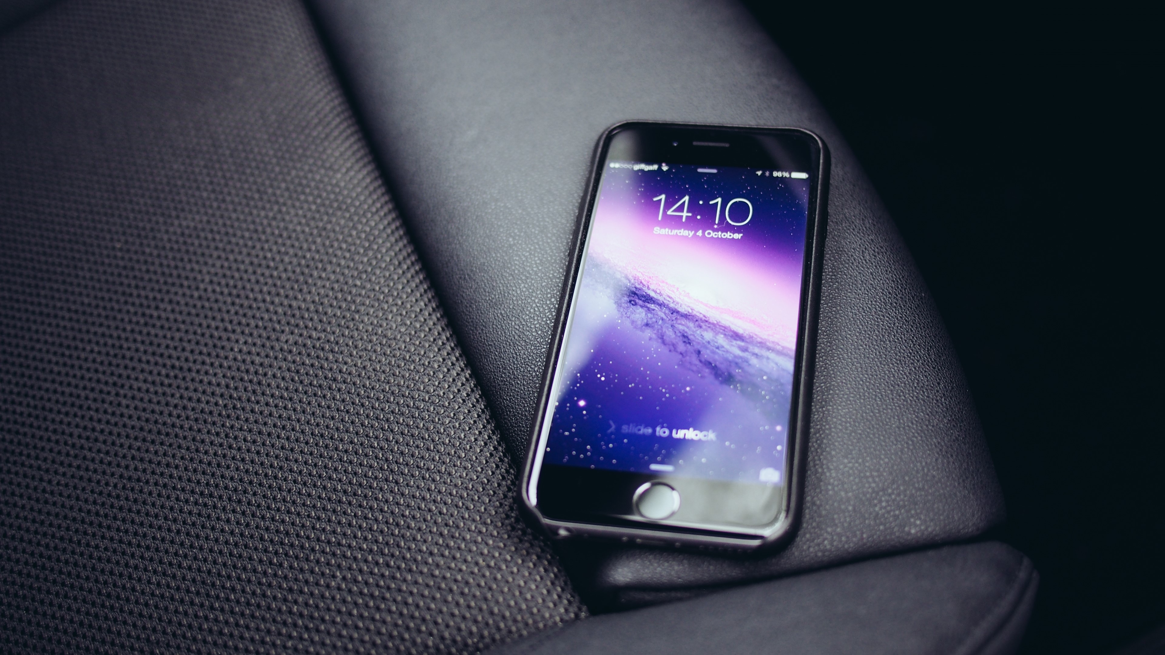 iPhone 6 on car seat HD Wallpaper