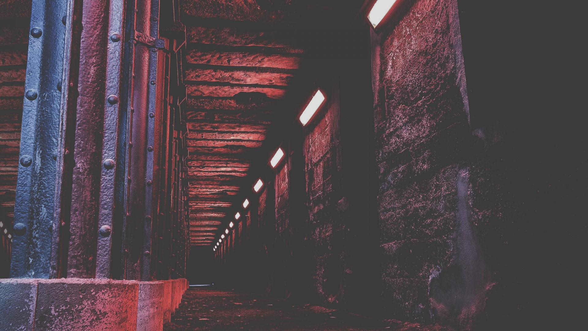 Red tunnel with industrial pillars and lights HD Wallpaper