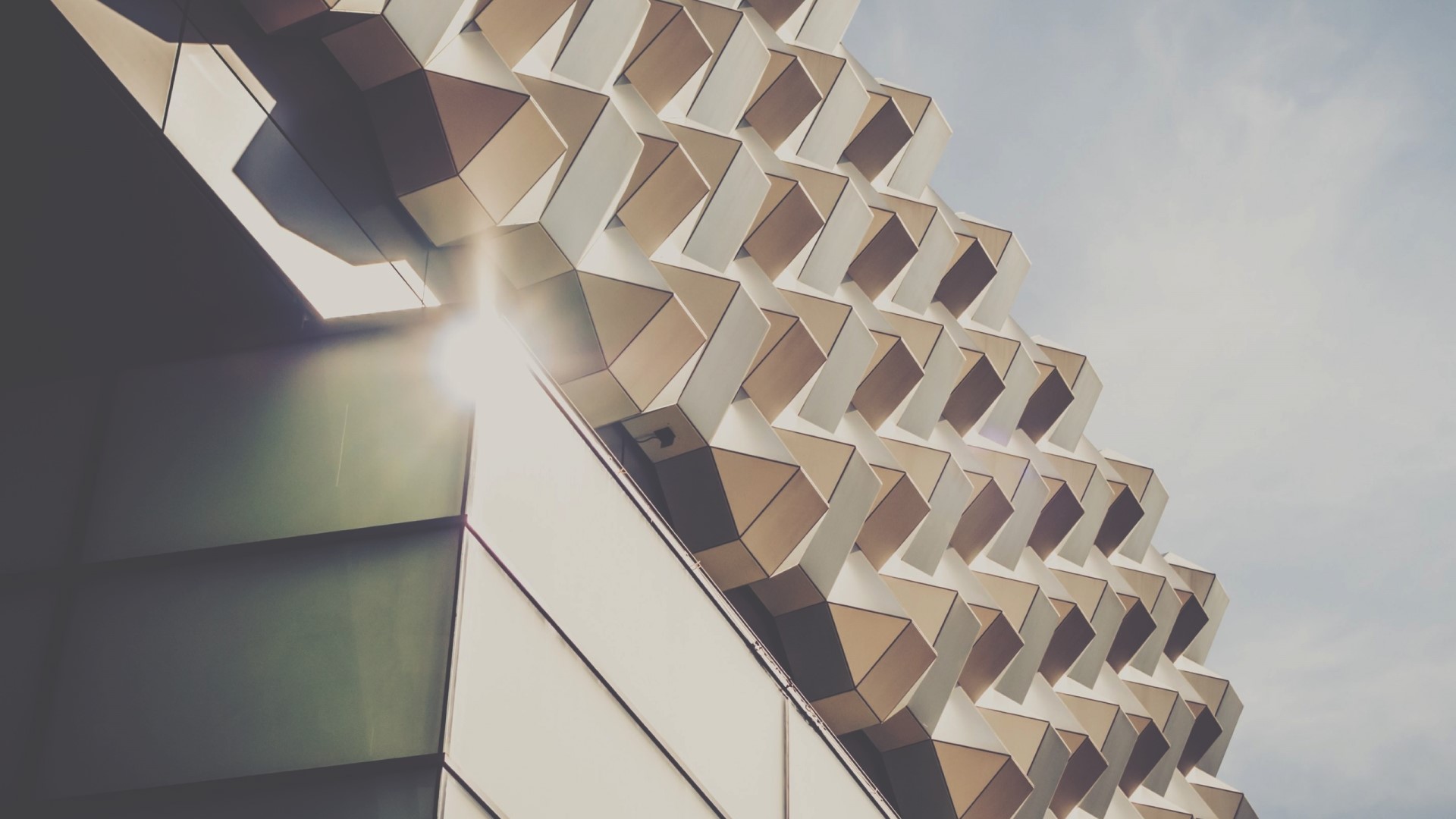 Geometric Facade with Sun Flare HD Wallpaper
