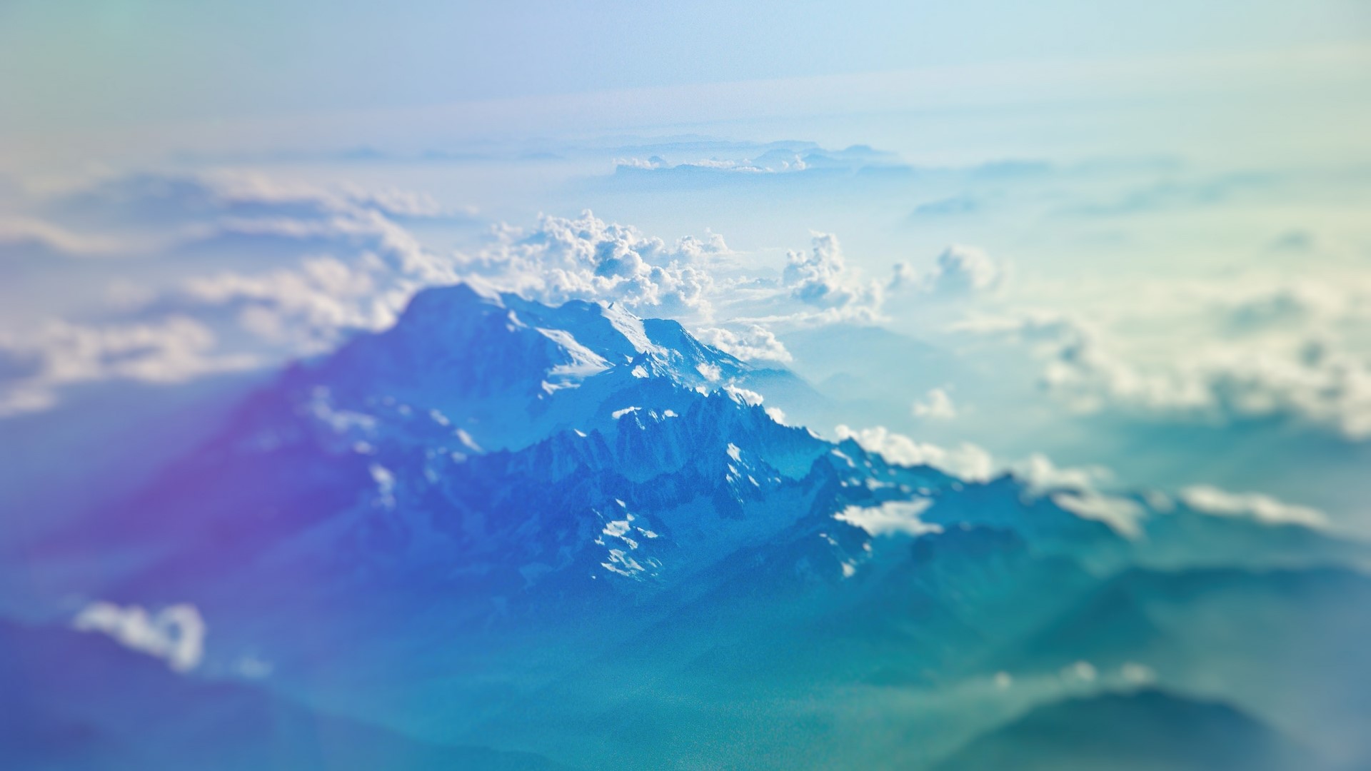 Snow-capped mountains above clouds HD Wallpaper