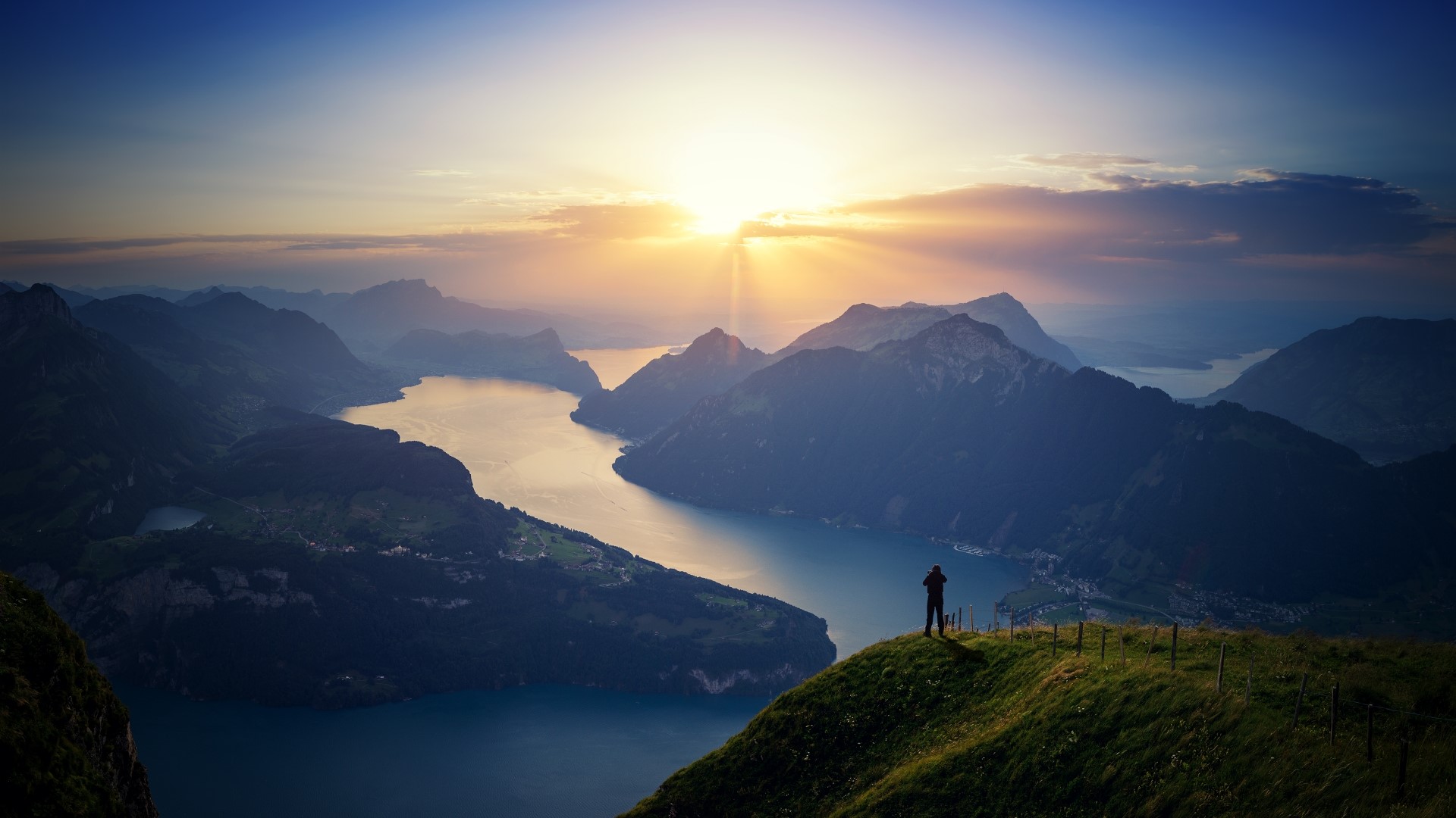 Man overlooking Lake Lucerne at sunrise HD Wallpaper