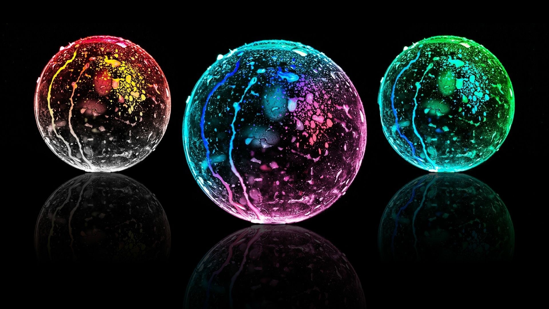 Three glowing orbs with reflections HD Wallpaper