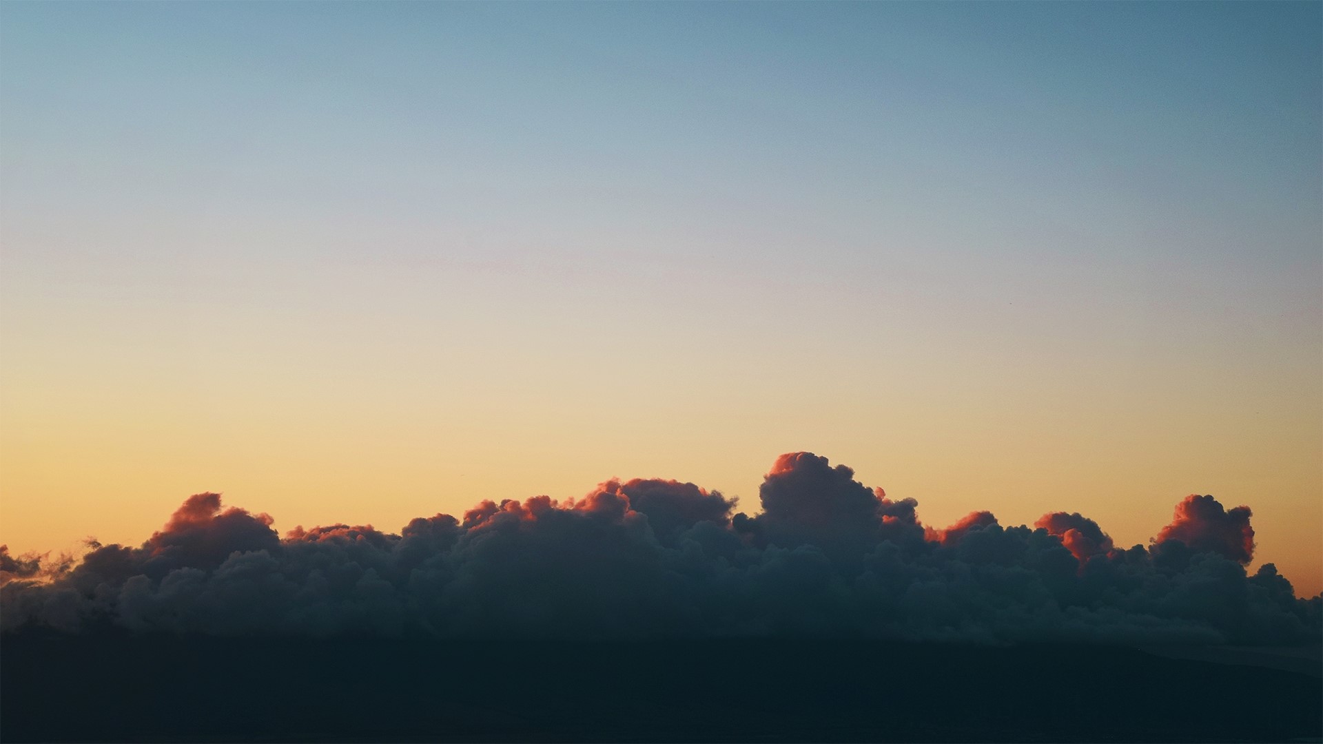 Clouds at sunset with pink highlights HD Wallpaper