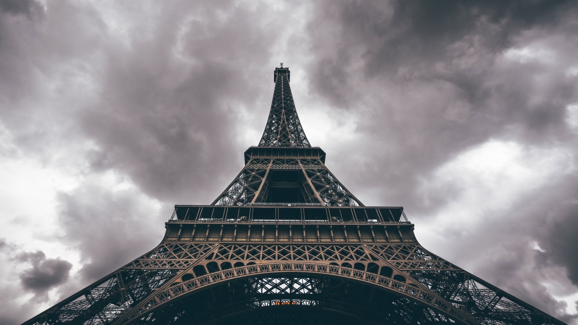 Eiffel Tower against a cloudy sky HD Wallpaper
