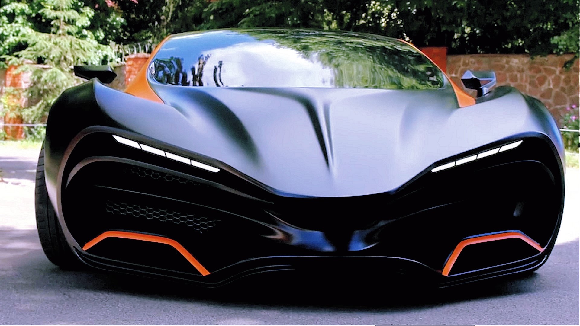 Futuristic orange and black sports car HD Wallpaper