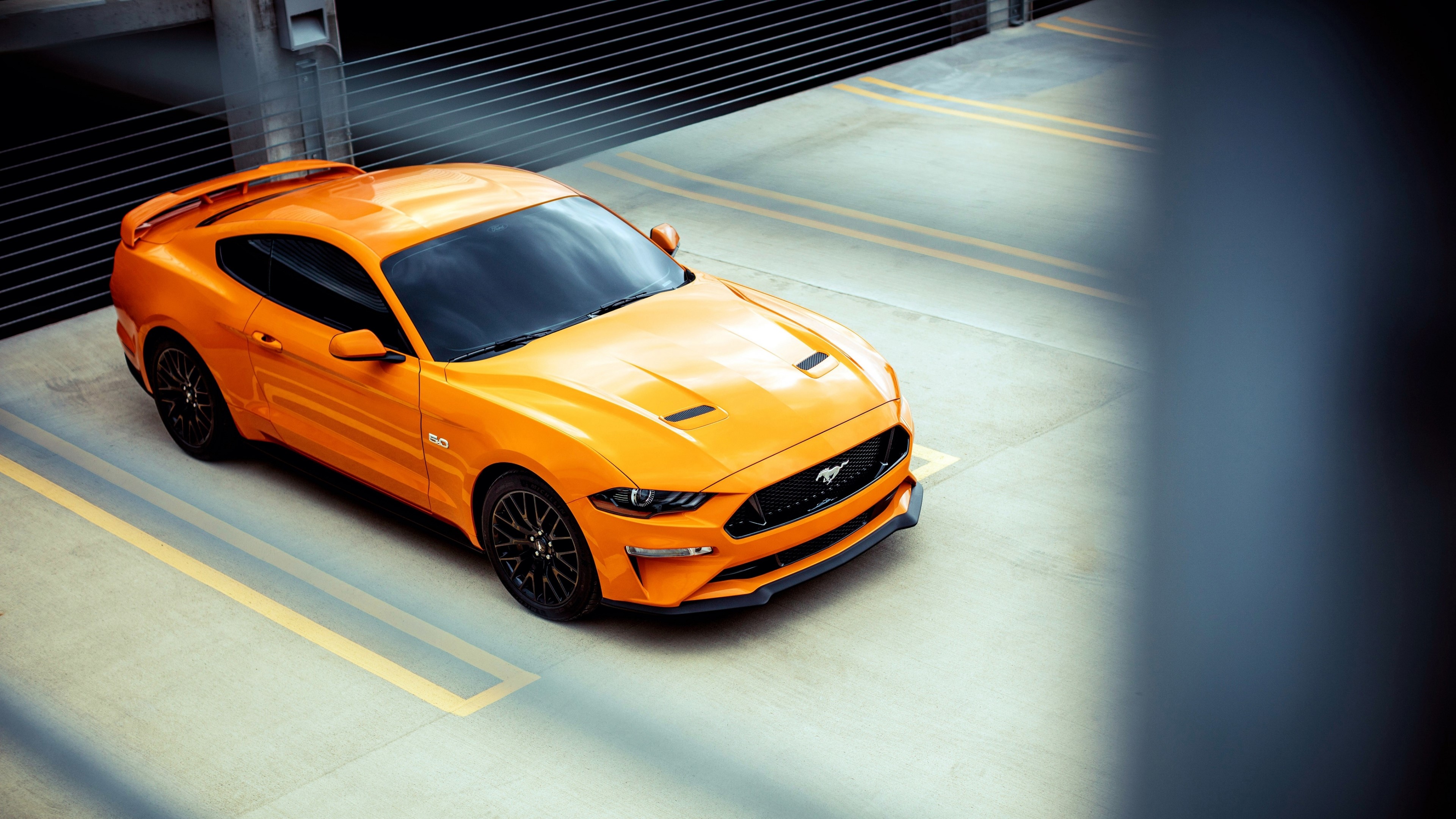 Orange Ford Mustang GT parked in a lot HD Wallpaper