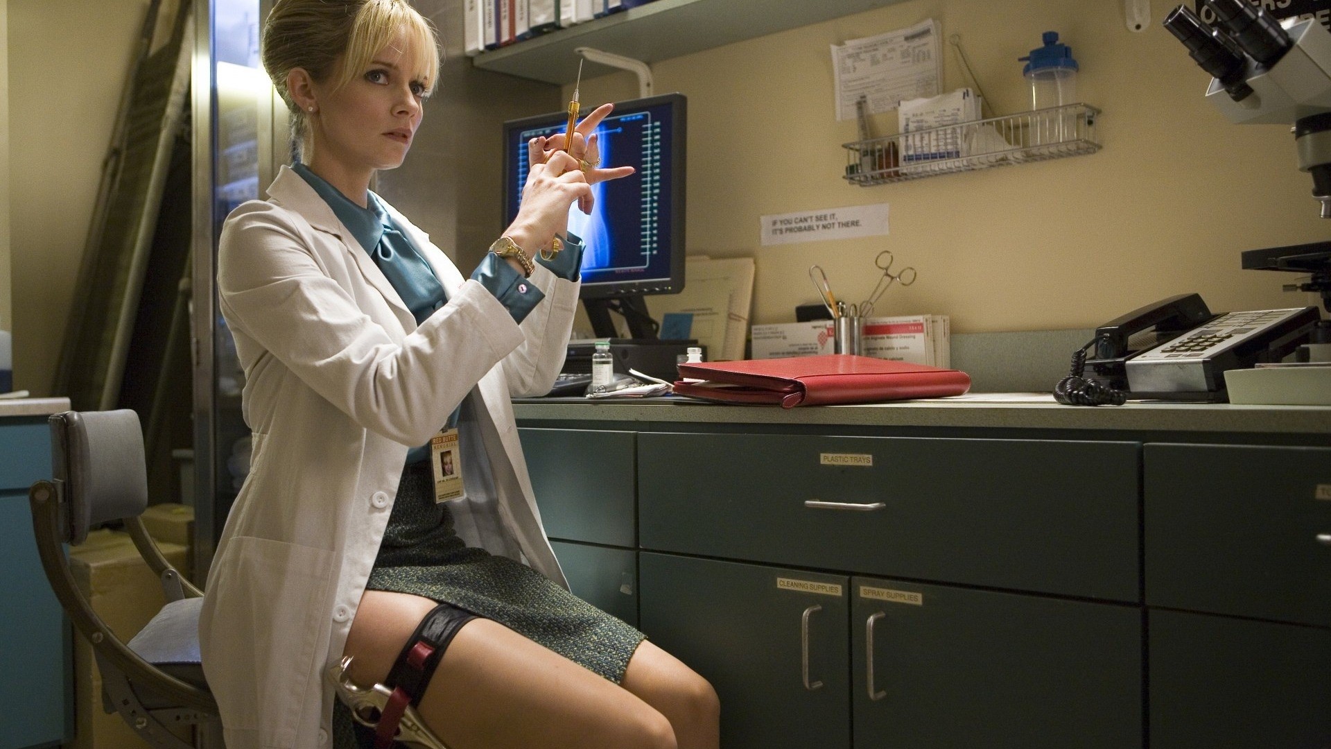 Woman in lab coat holding syringe HD Wallpaper