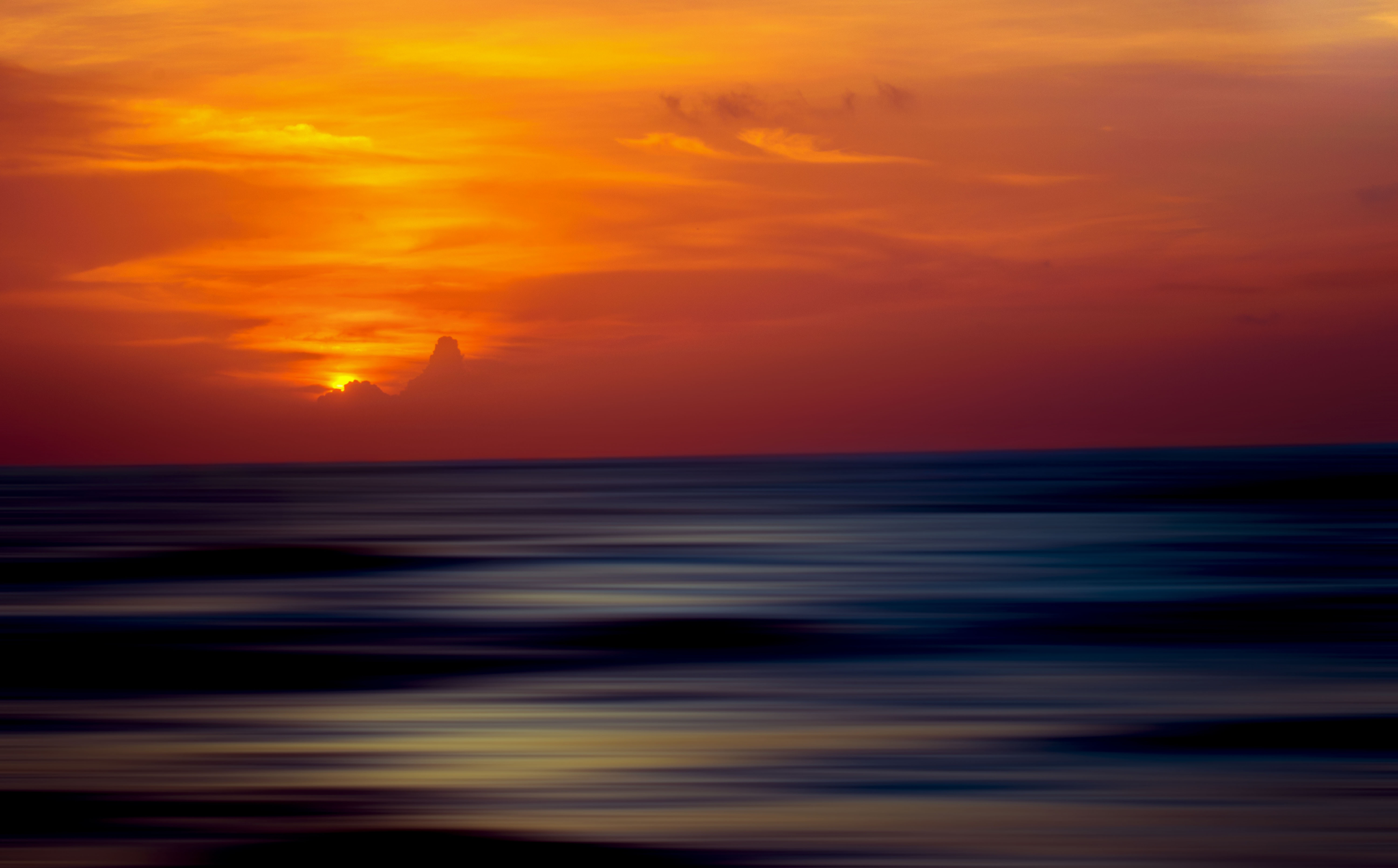 Sunset over the ocean with clouds HD Wallpaper