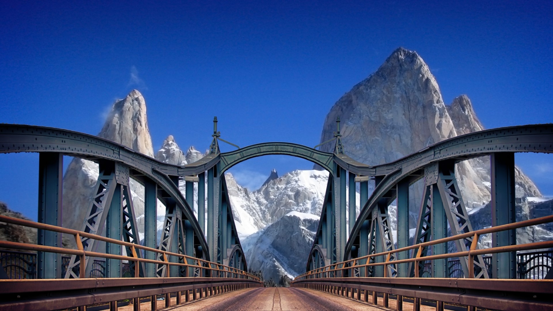 Metal bridge with mountains in the background HD Wallpaper
