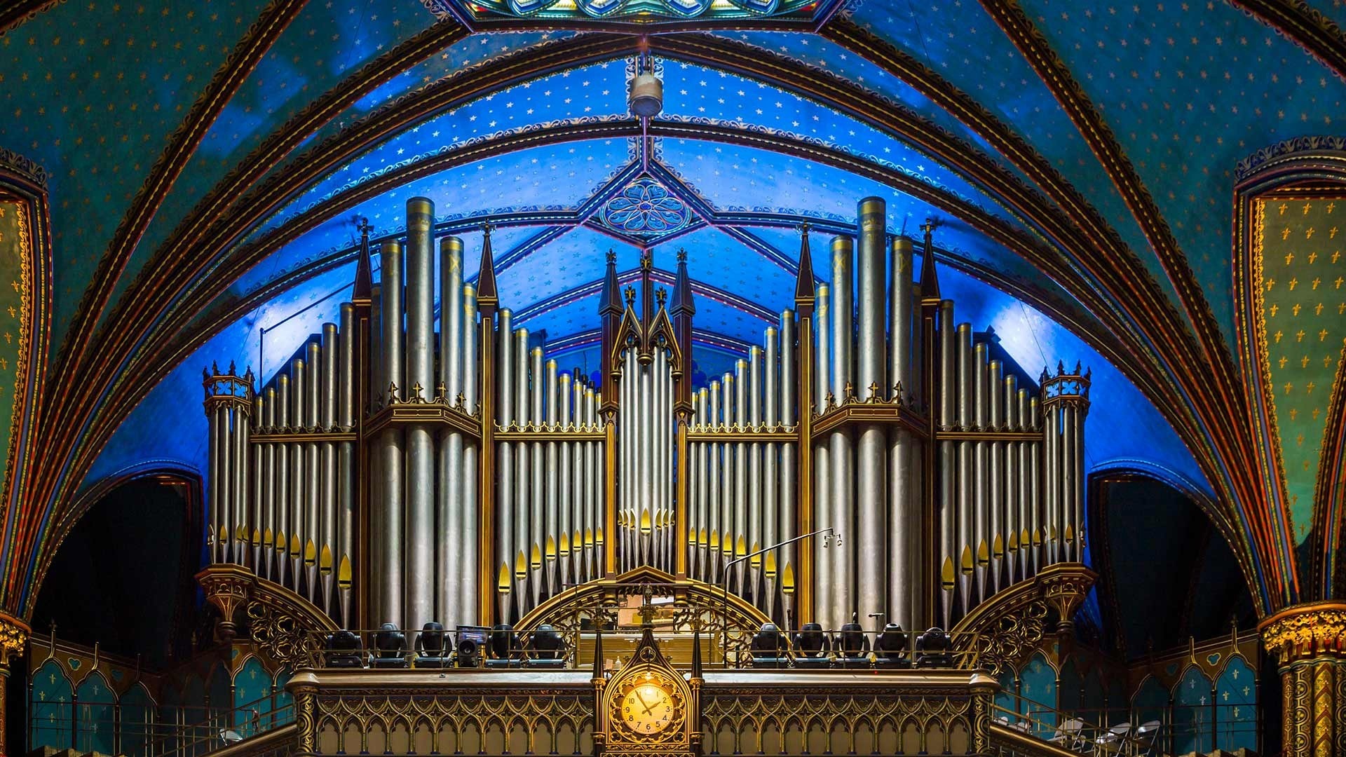 Grand pipe organ inside a blue and gold cathedral HD Wallpaper