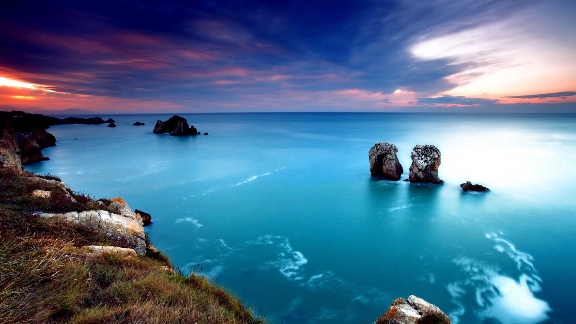 Cliff by the sea at sunset HD Wallpaper