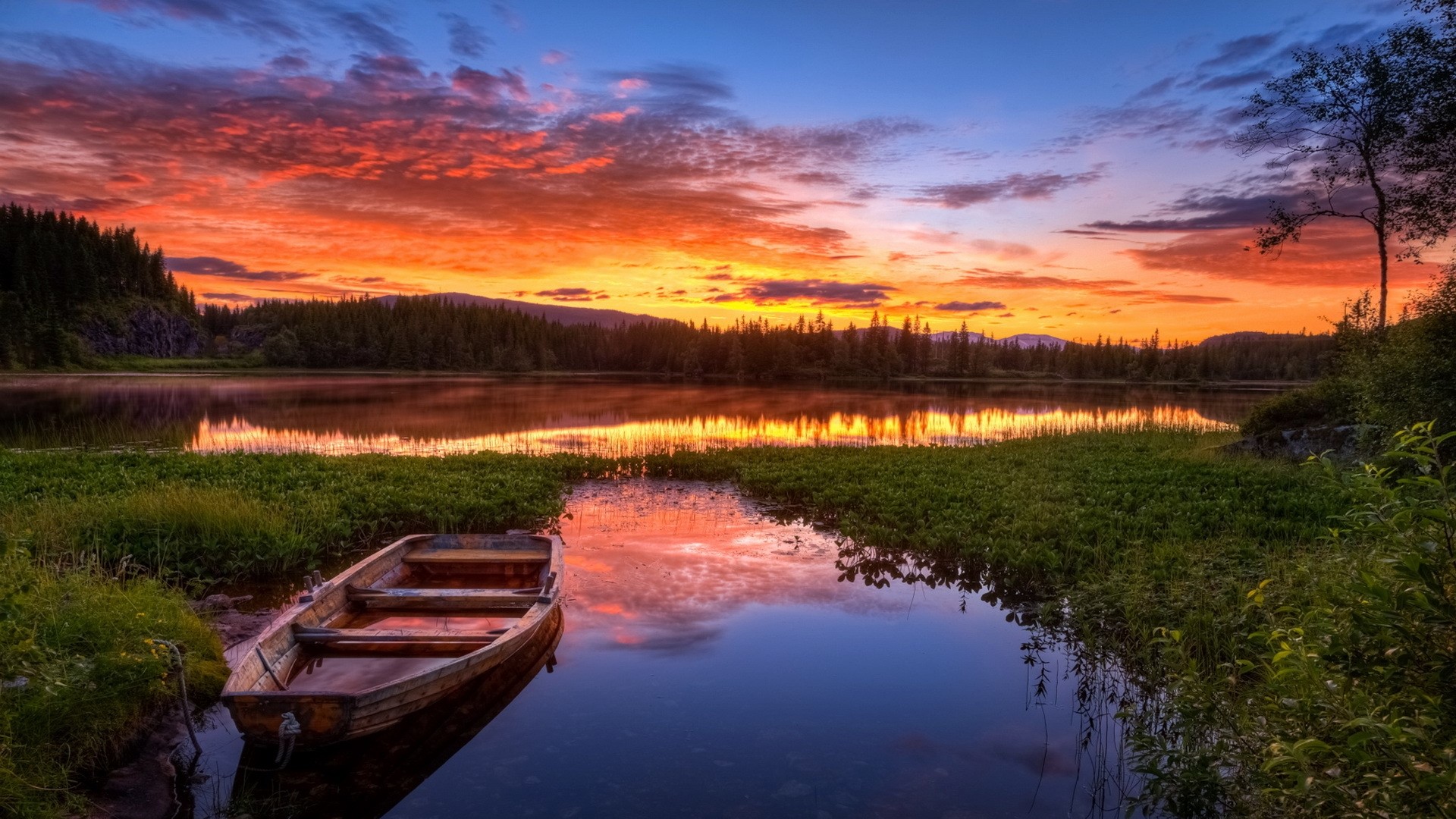 Boat on a lake at sunset in Norway HD Wallpaper
