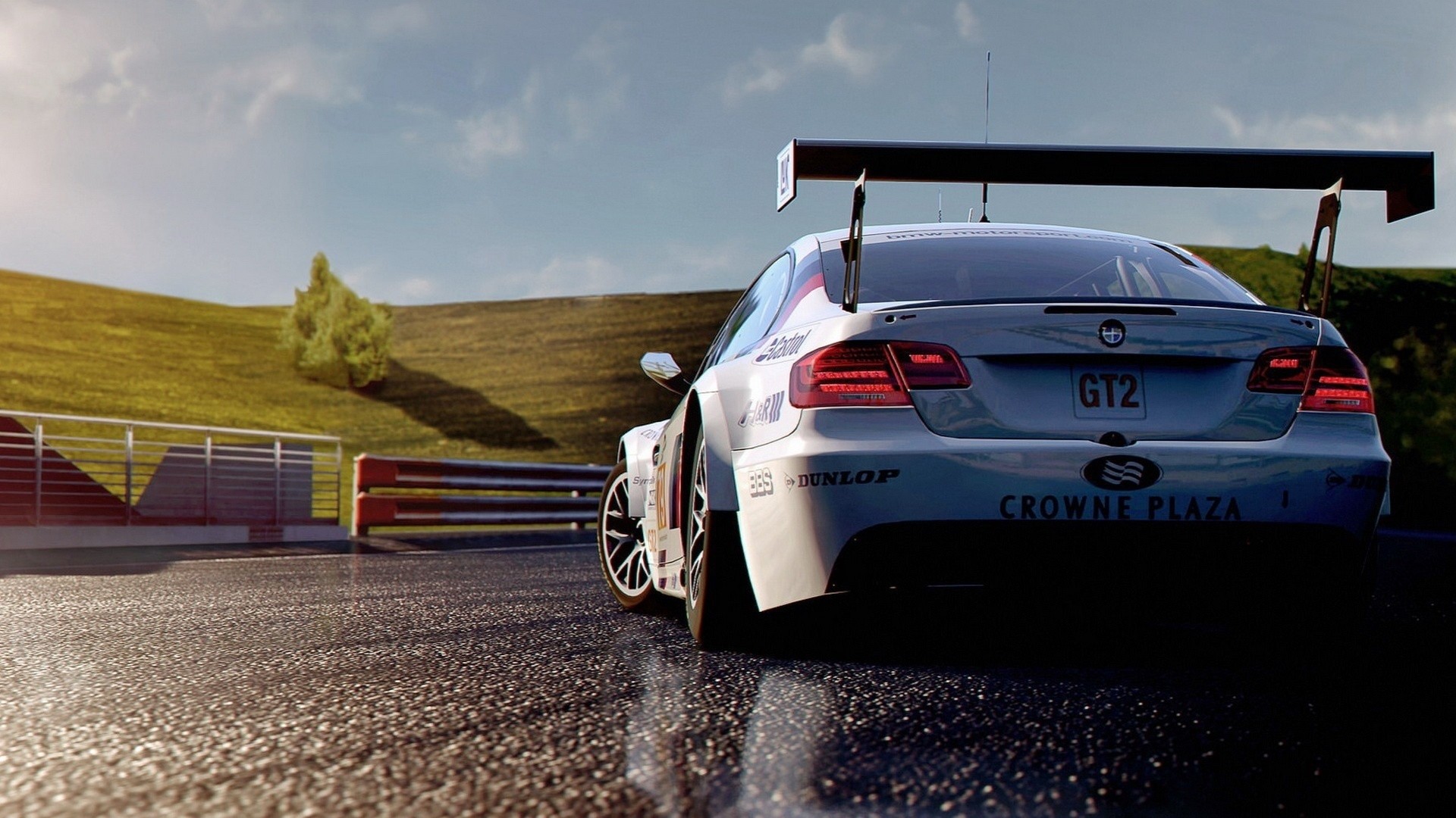 BMW GT2 race car on a wet track HD Wallpaper