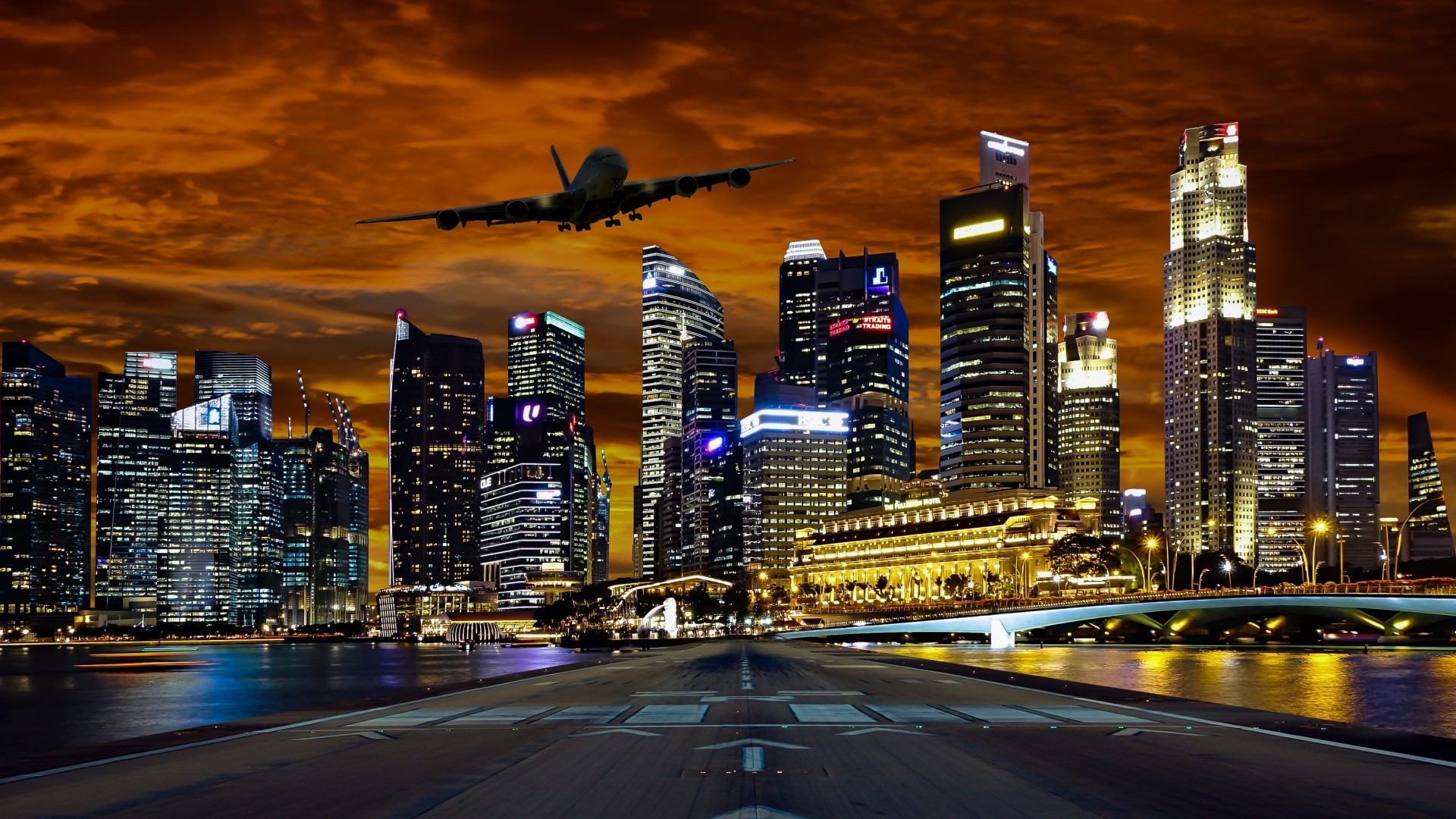 Airplane flying over Singapore skyscrapers at sunset HD Wallpaper