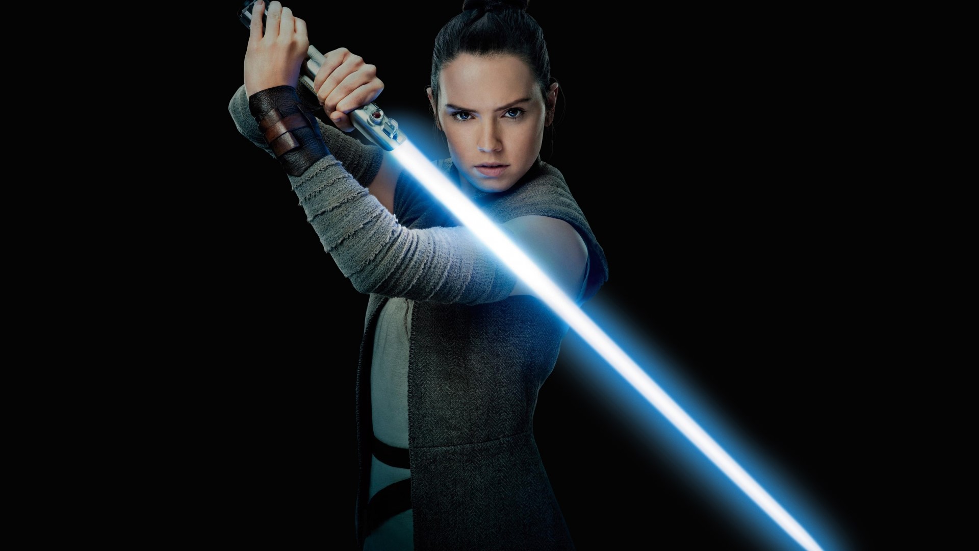 Rey from Star Wars with a blue lightsaber HD Wallpaper