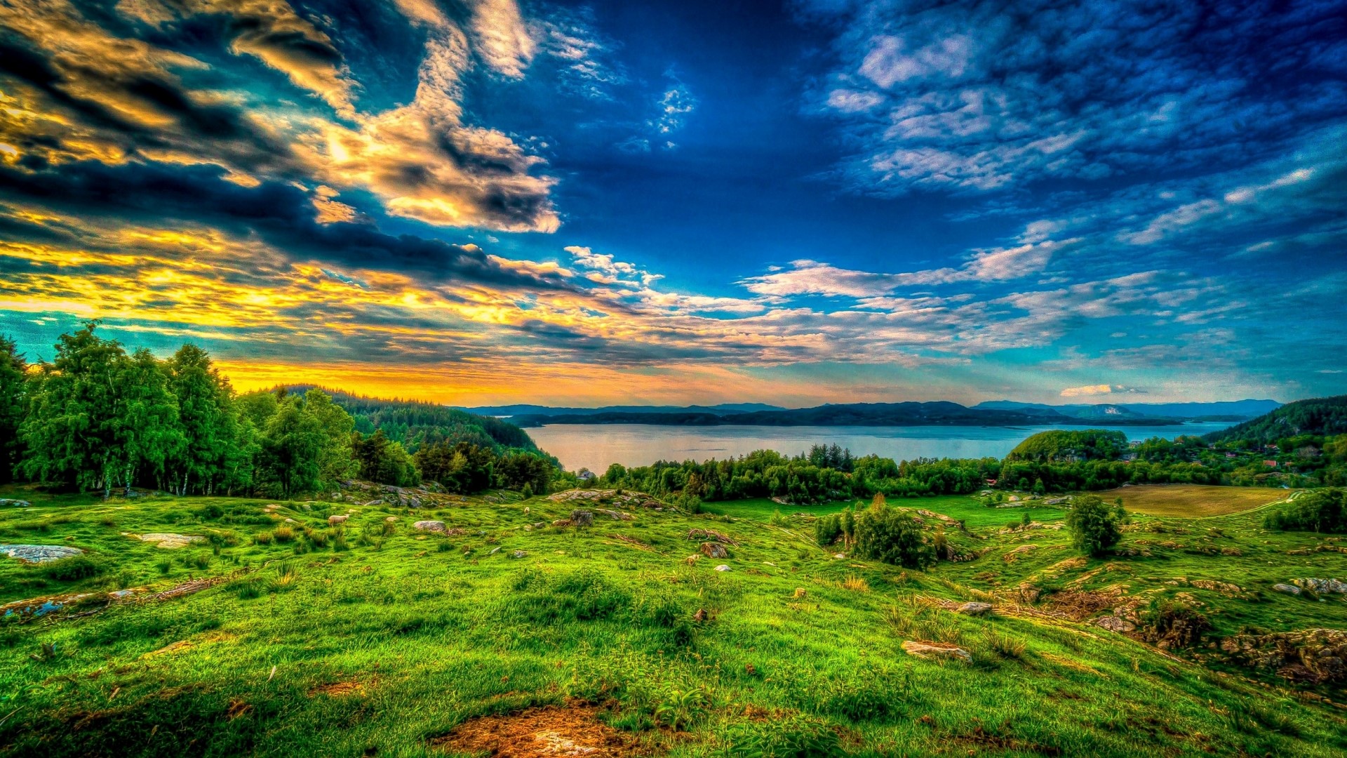 Green hills and lake at sunset HD Wallpaper